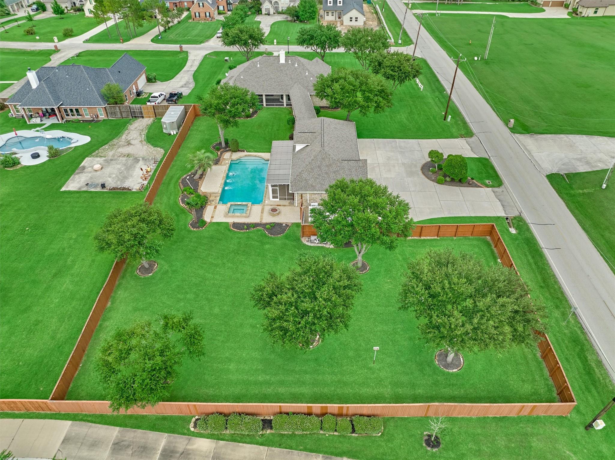 Image 2: Eleven mature oak trees surround the property. The