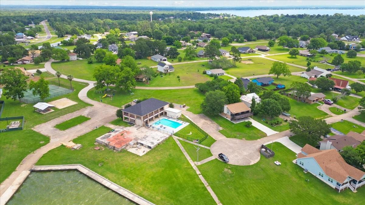 Image 3: Elevated aerial view featuring community pool area