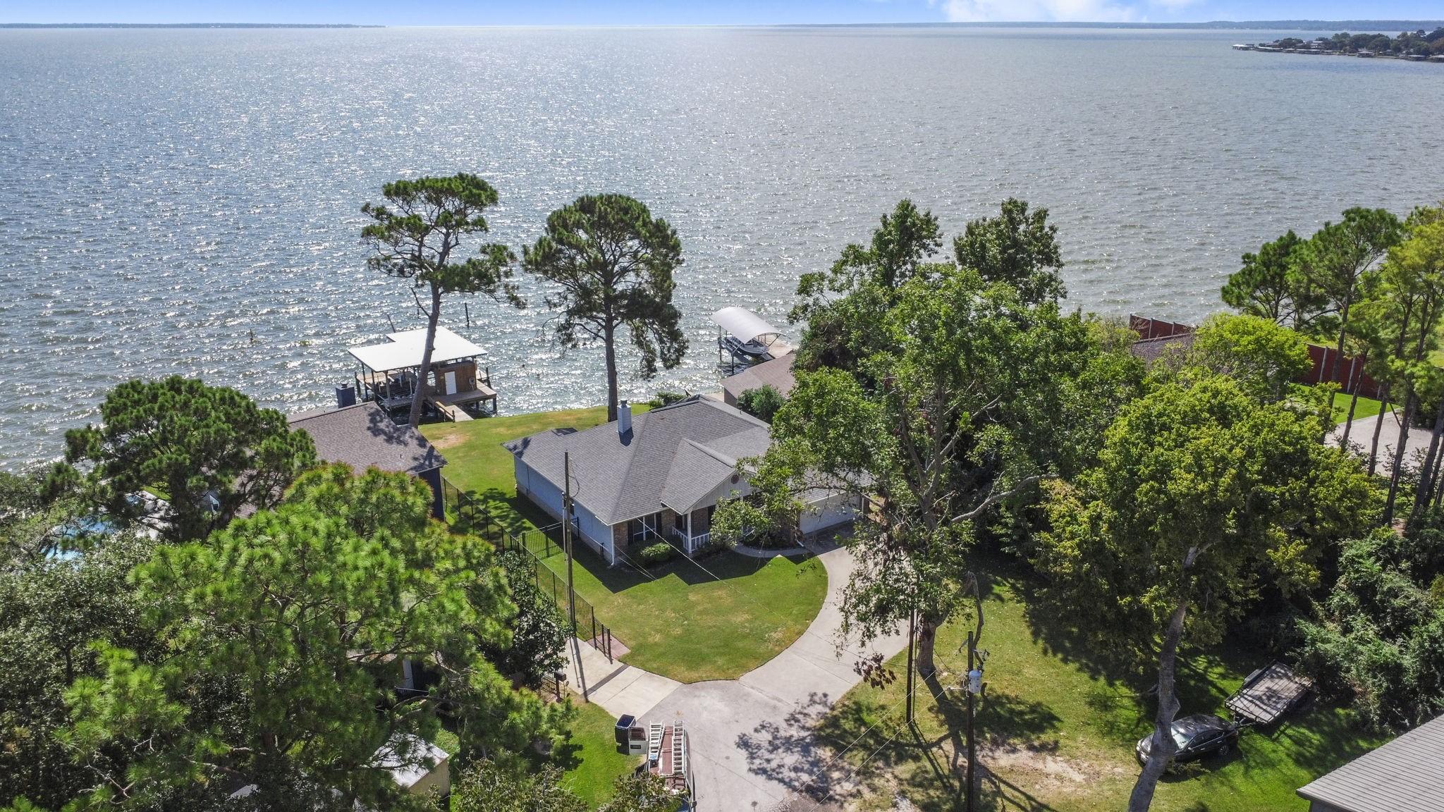 Image 1: Aerial View of home on 7 lots with boathouse