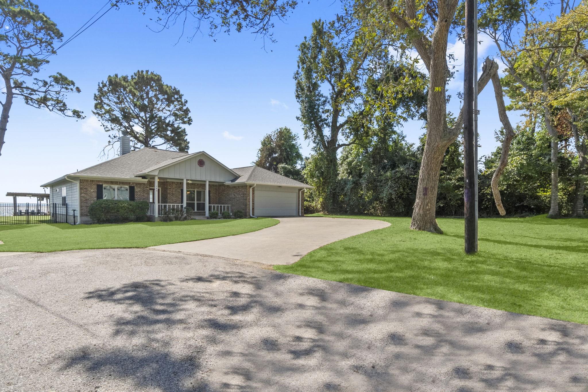 Image 2: Front view of home/Grass enhanced by photographer