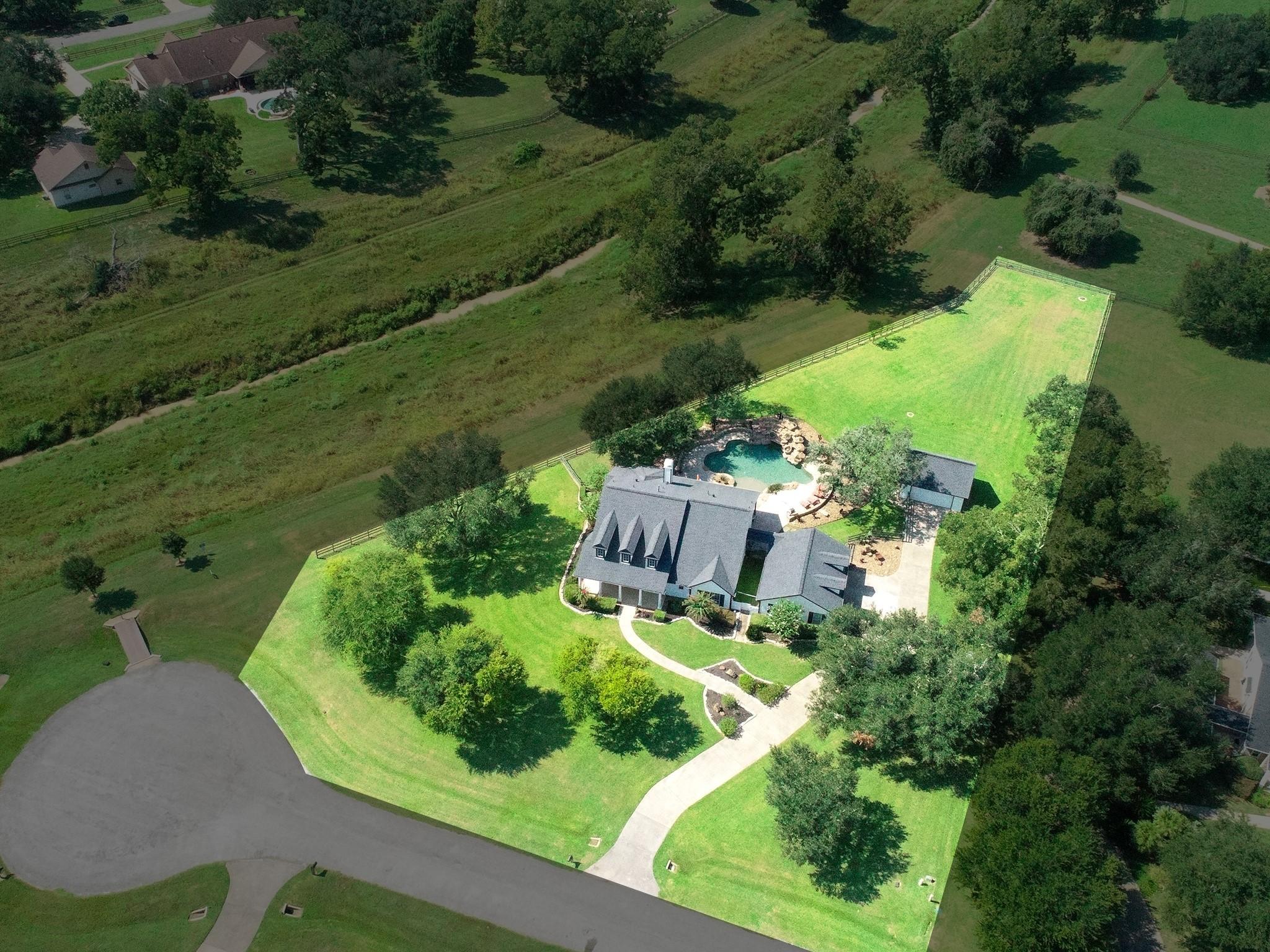 Image 4: An aerial view reveals the home&rsquo;s ideal position o