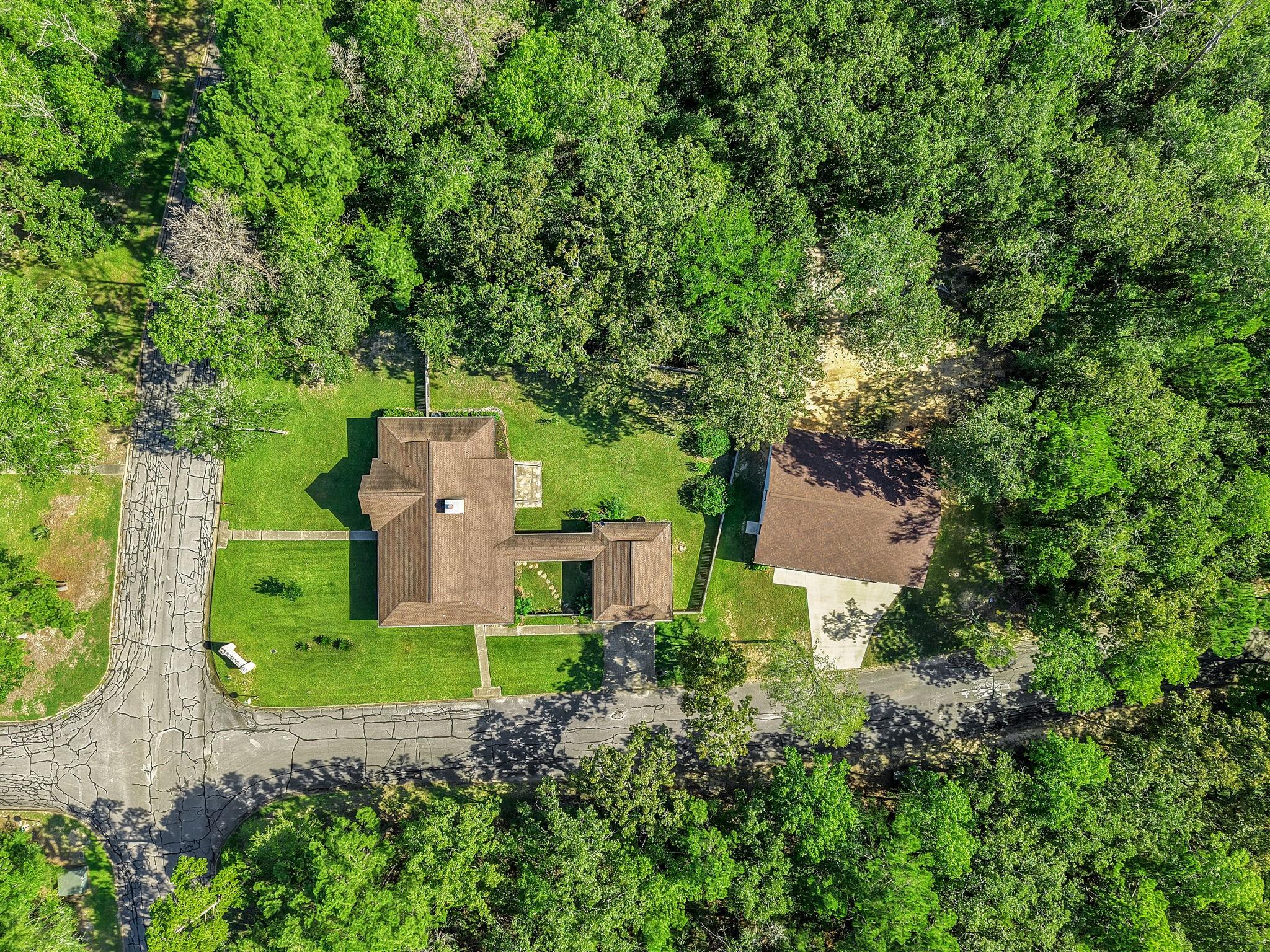 Image 3: Expansive dual-lot oasis featuring a charming prim