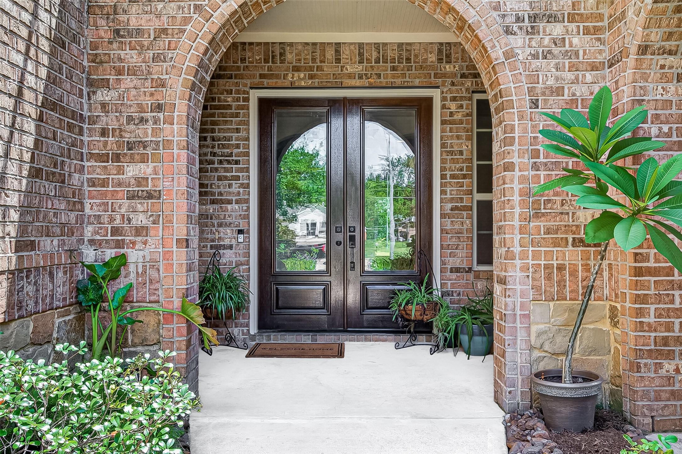 Image 3: A stunning set of double front doors makes a memor