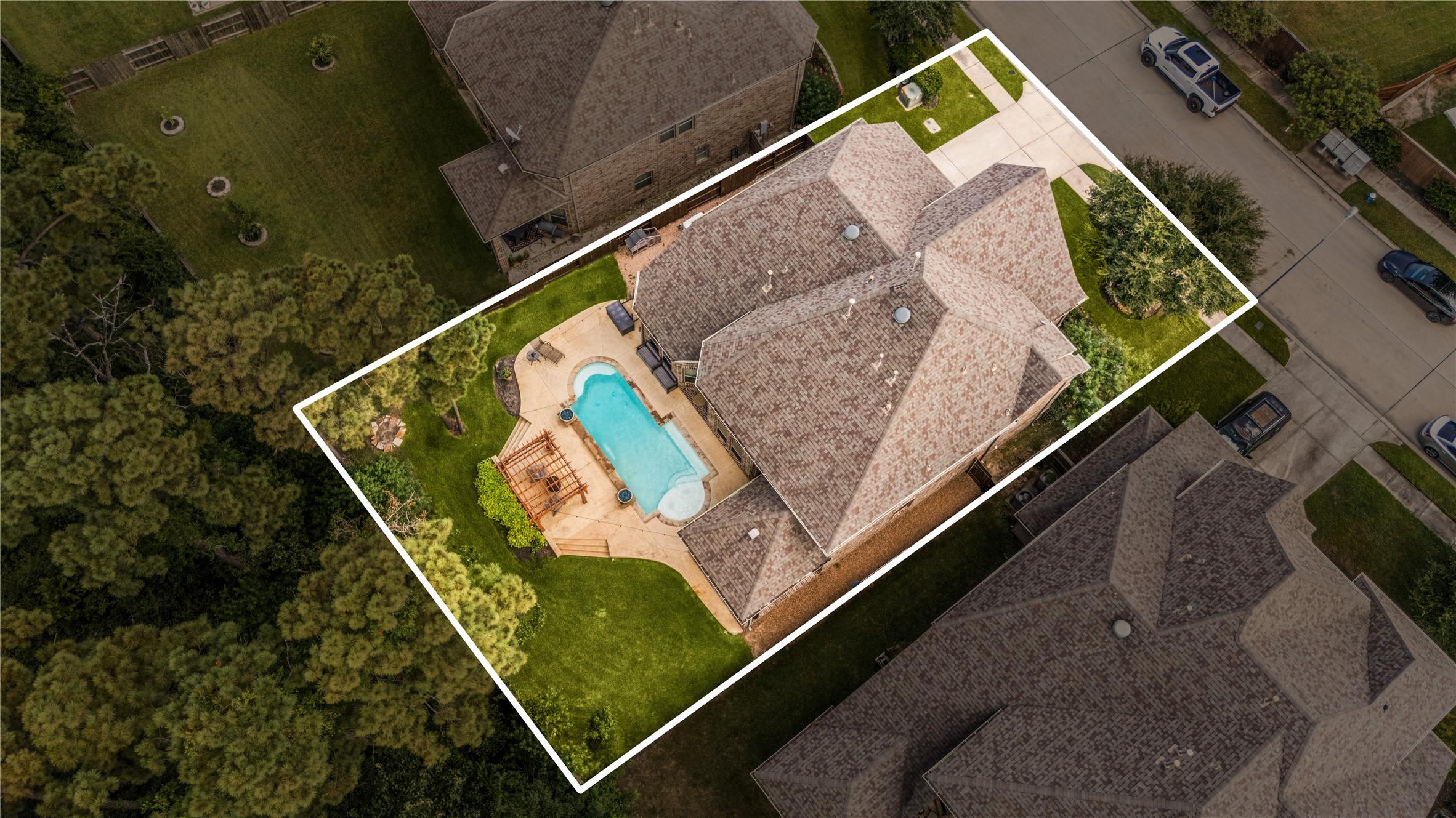 Image 2: This home sits on a large lot with ample yard spac