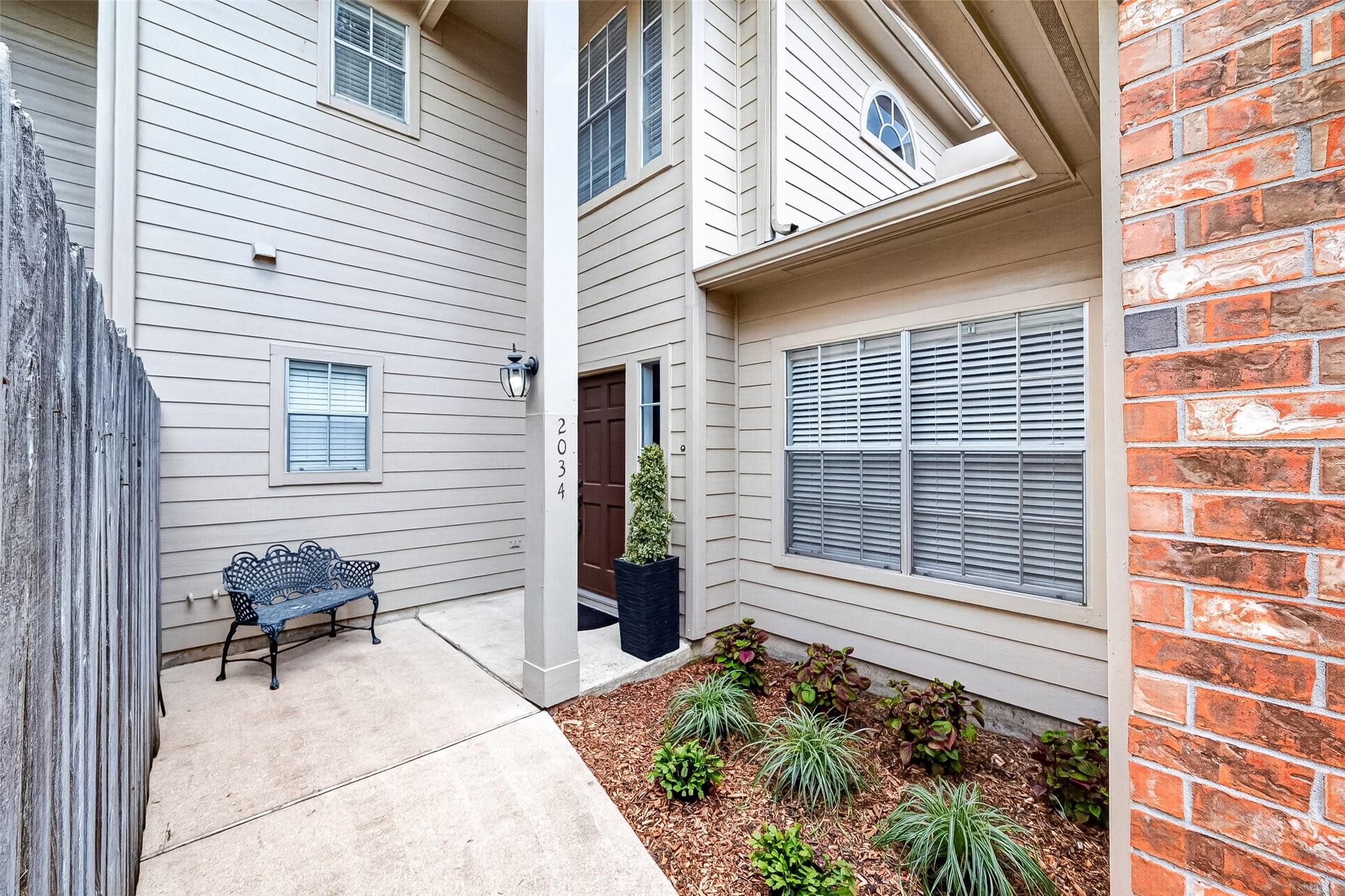 Image 3: Private courtyard entry welcomes you with low-main