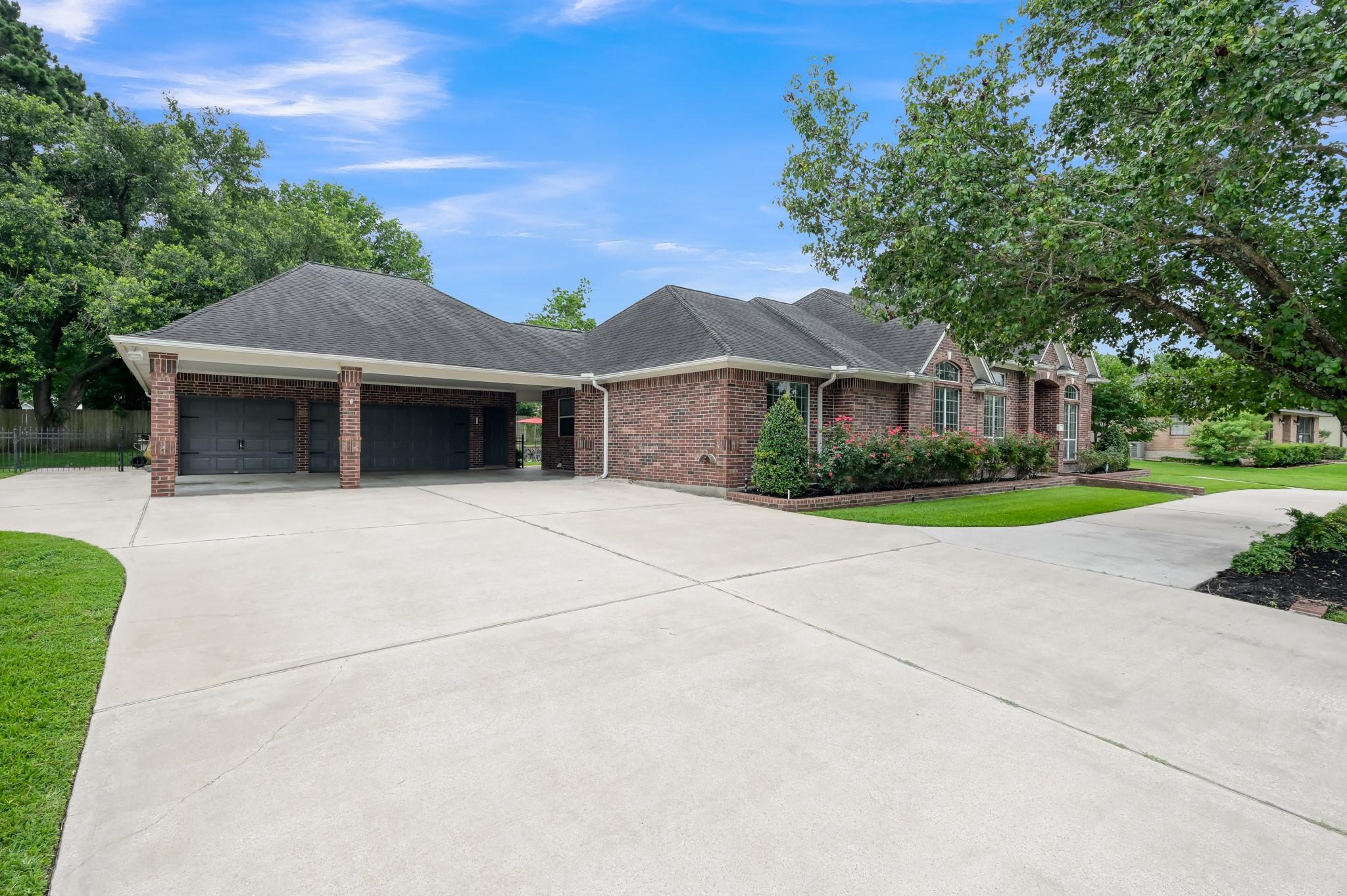 Image 2: A second half-bath is in this 3 car garage with at