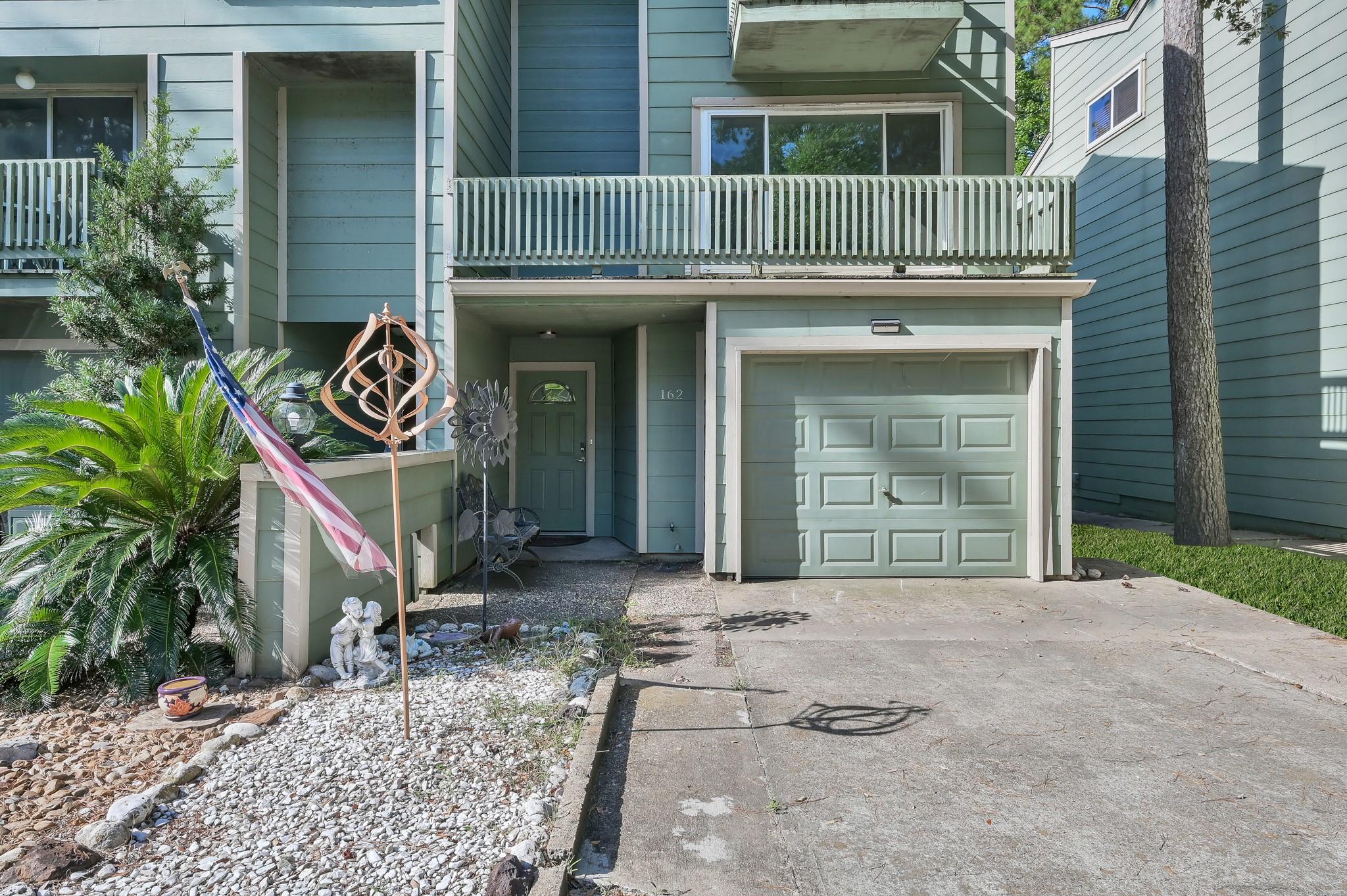 Image 2: Charming townhouse with a welcoming front porch an