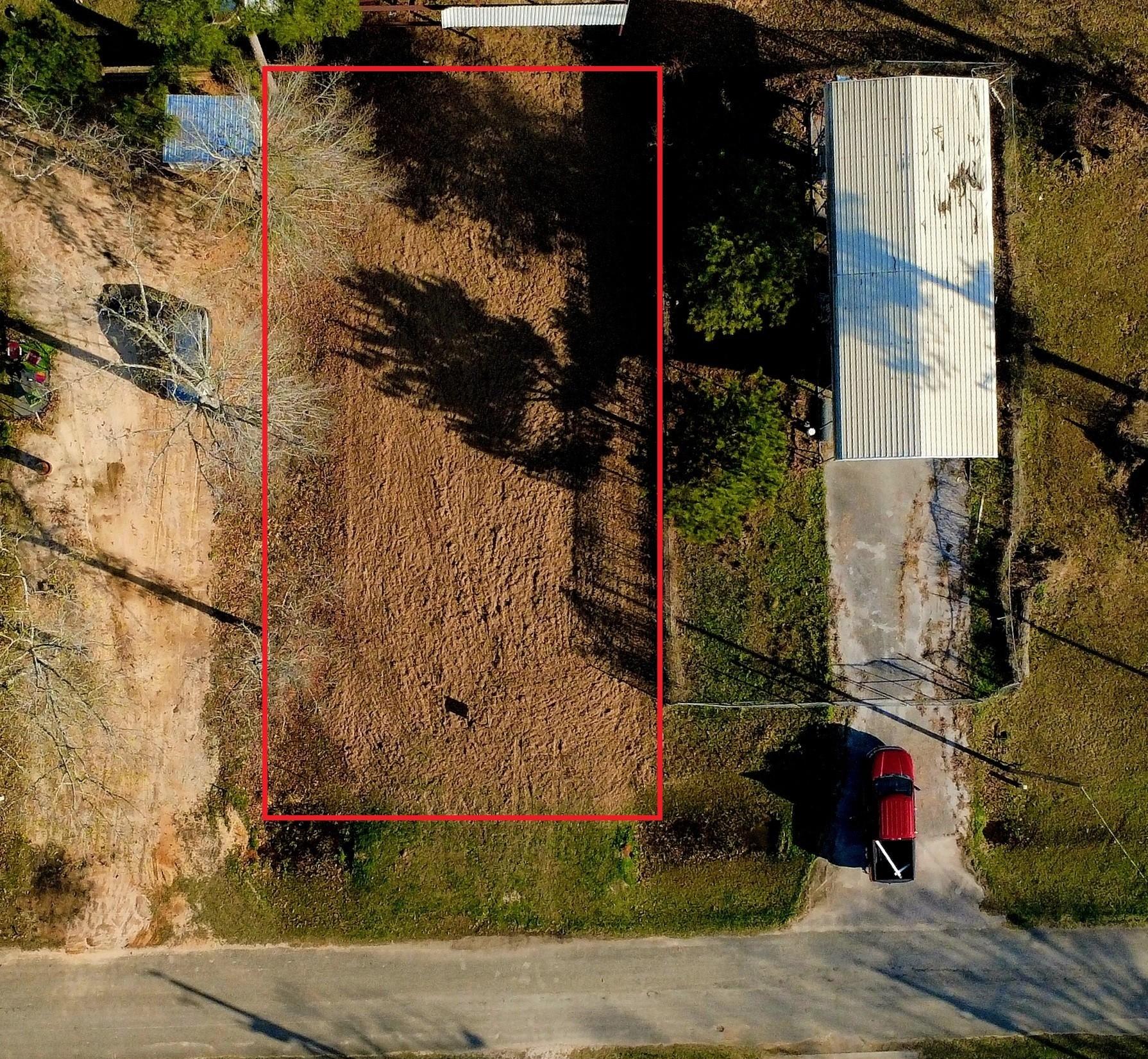 Image 2: Aerial view from property above. Property lines ar