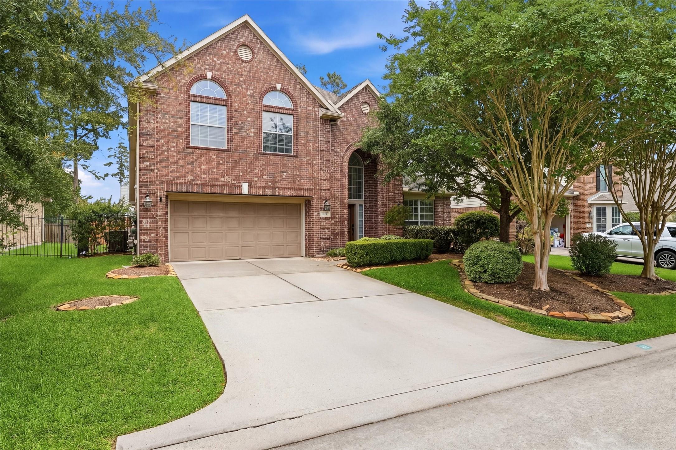 Image 2: This photo showcases a charming brick home with a