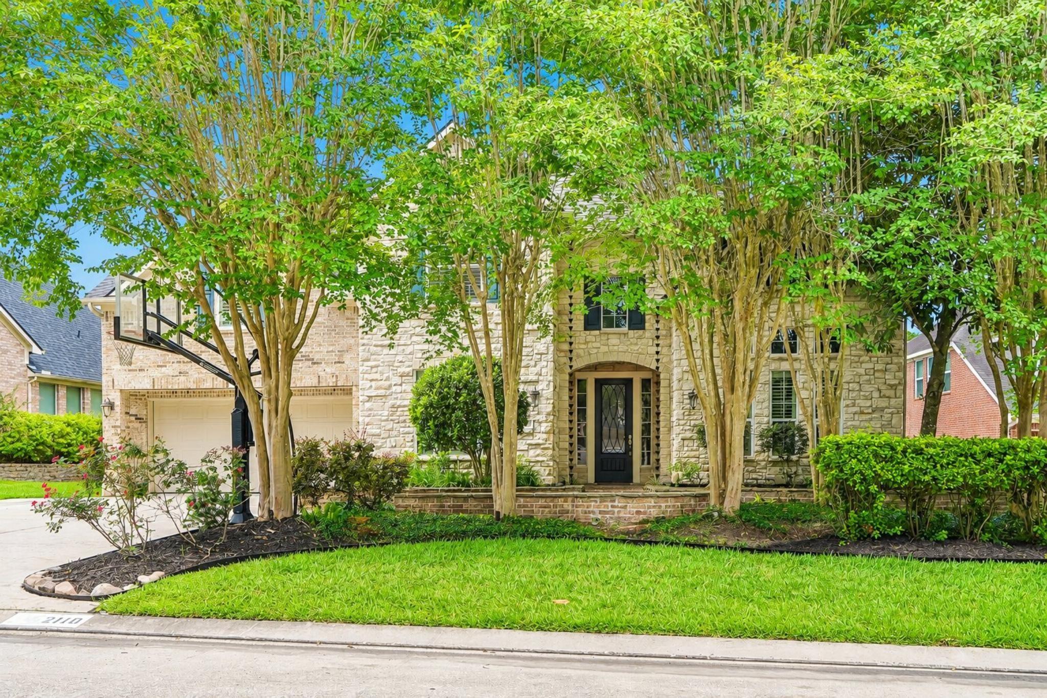 Image 3: From the street, this home already feels like some