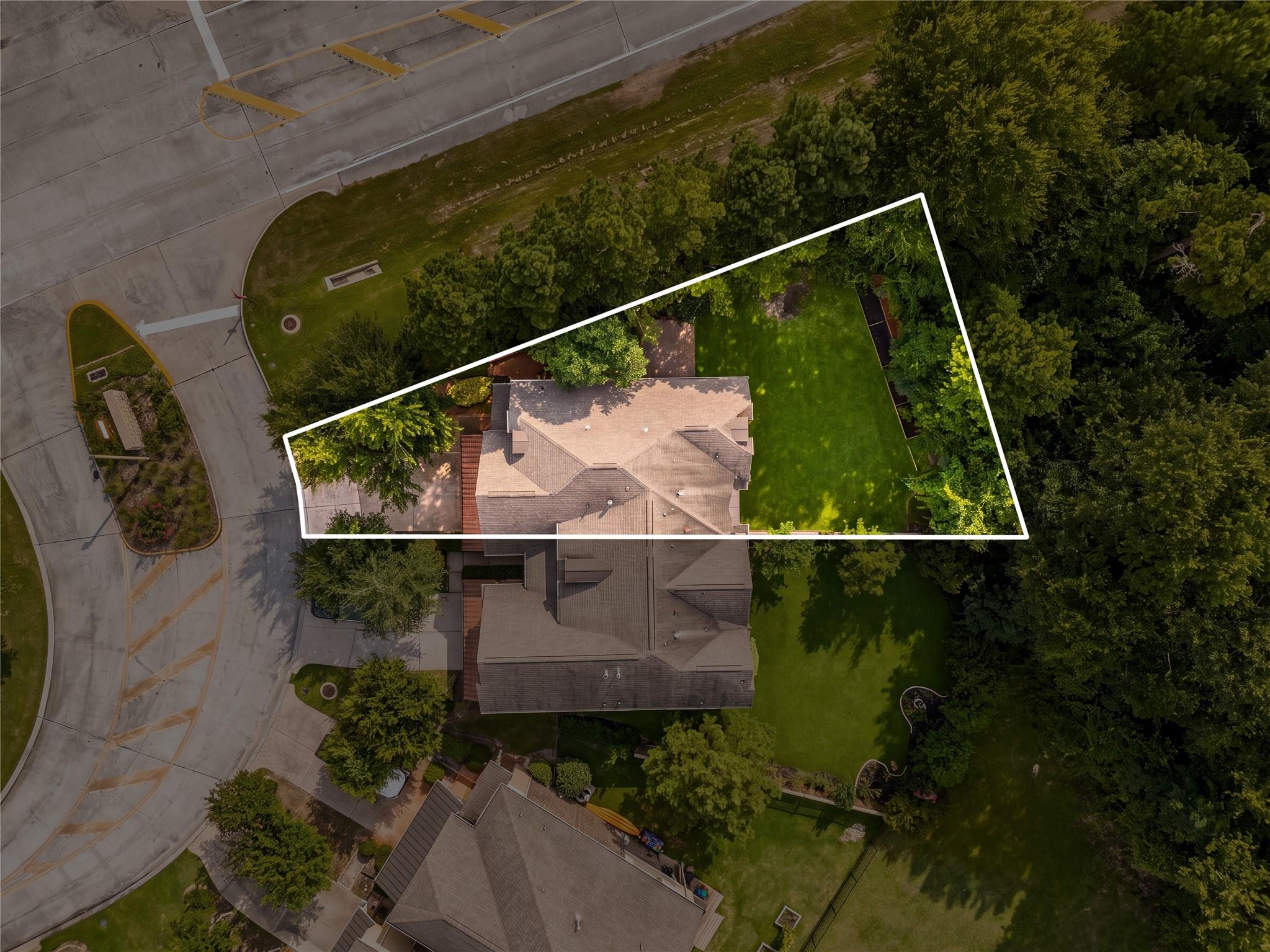 Image 2: This home sits on a large lot with ample yard spac