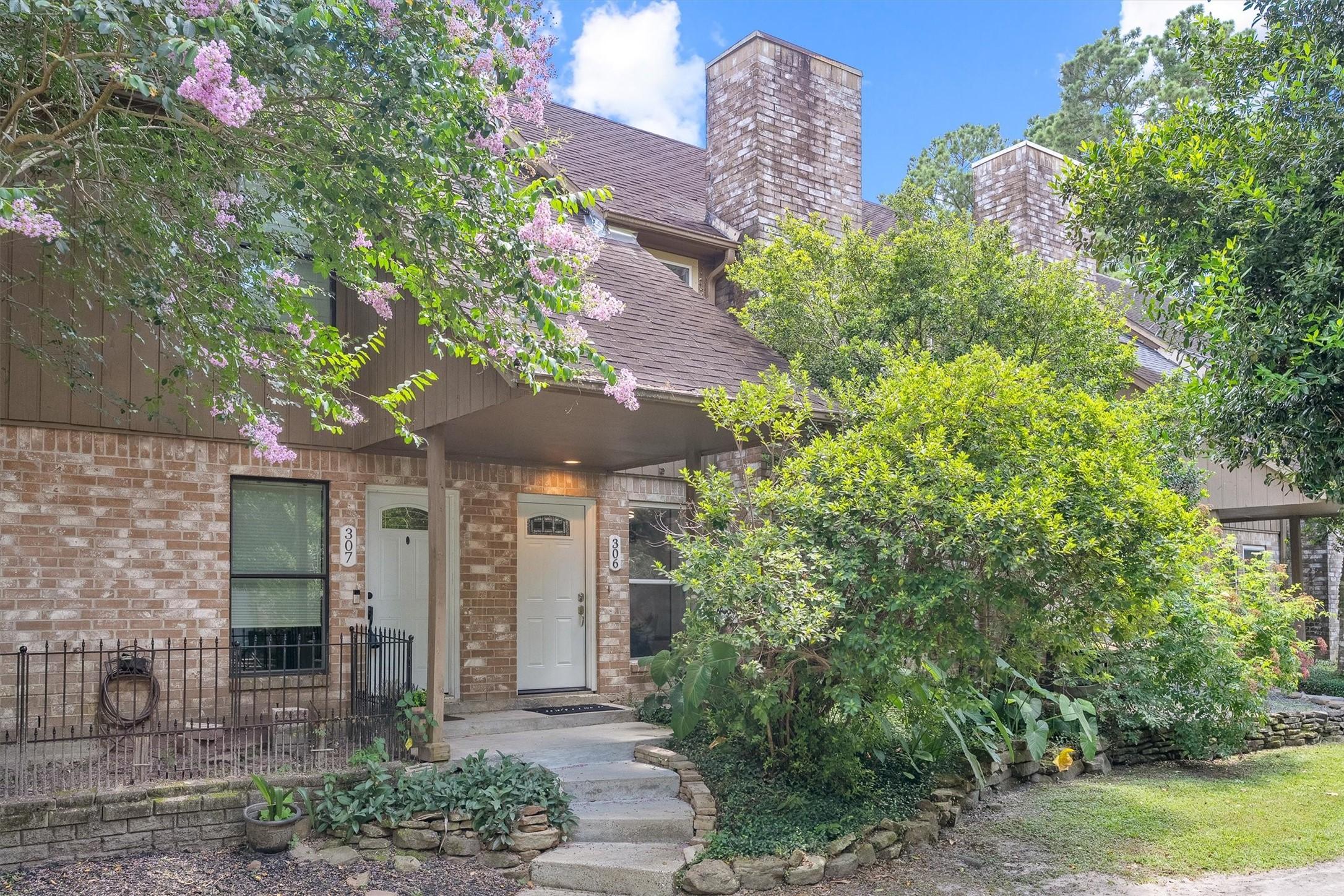 Image 2: This charming brick condo greets you with mature l