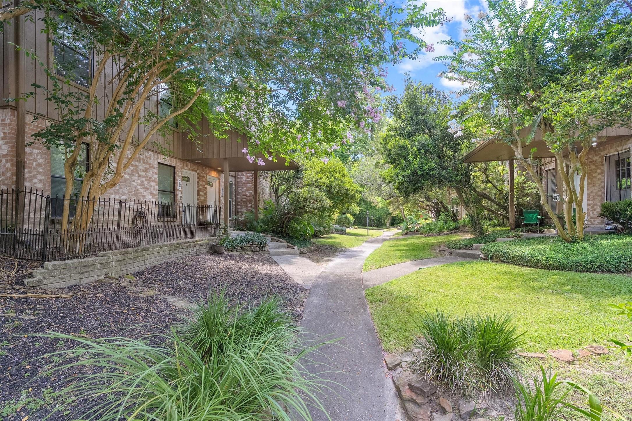 Image 3: A shared courtyard connects neighboring units here