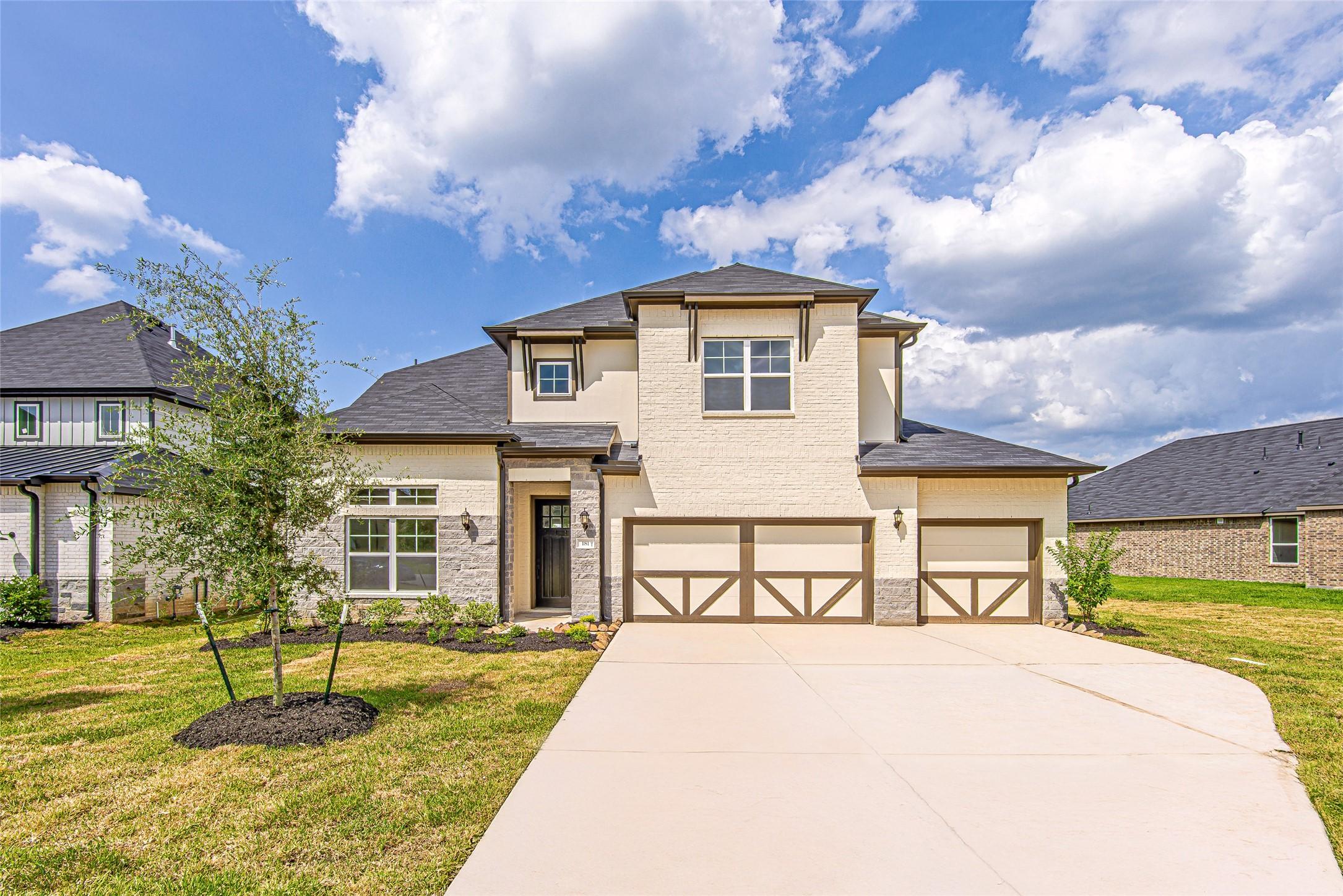 Image 1: A striking exterior view of the home showcases its