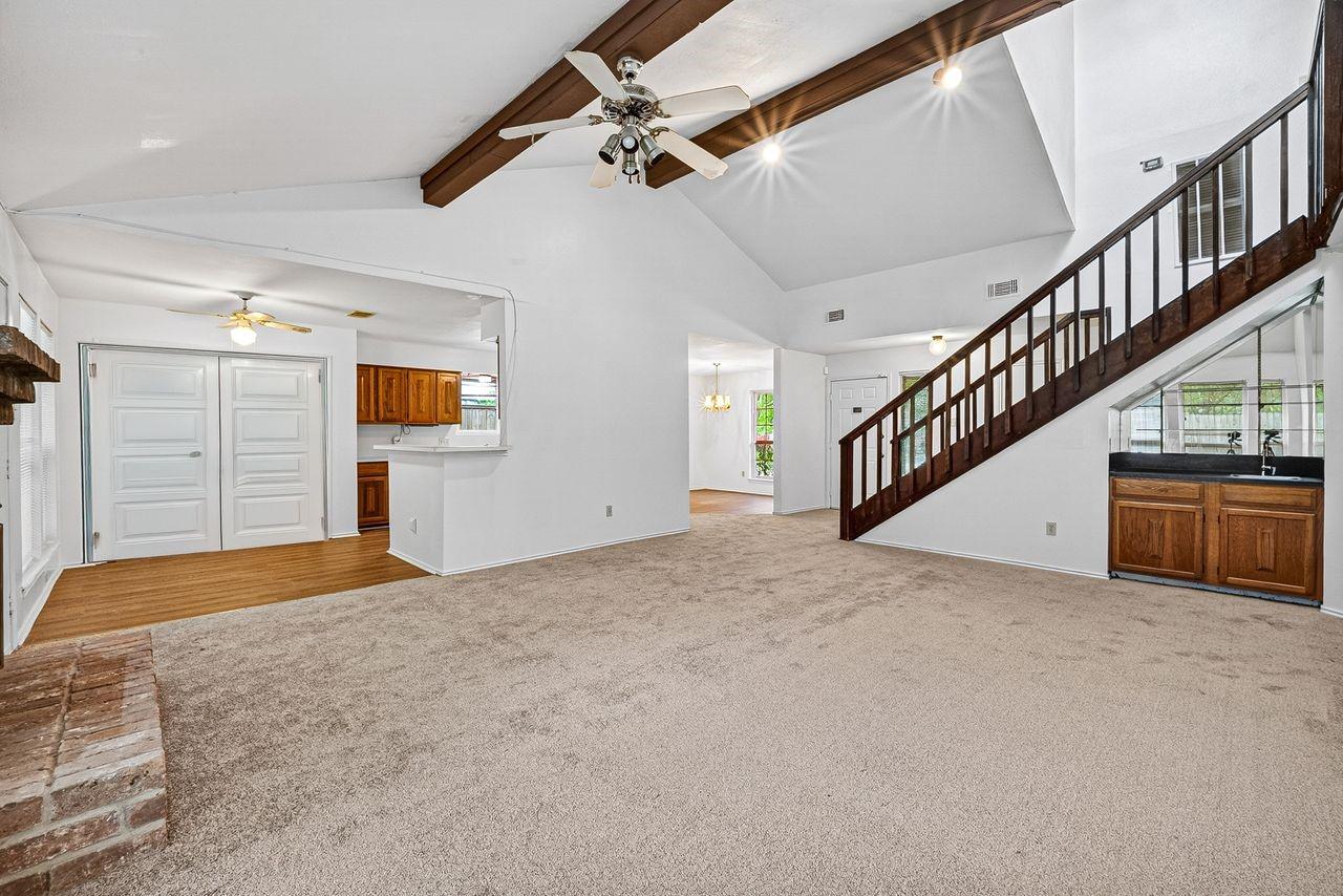 Image 2: Spacious living room with vaulted ceilings and  wo