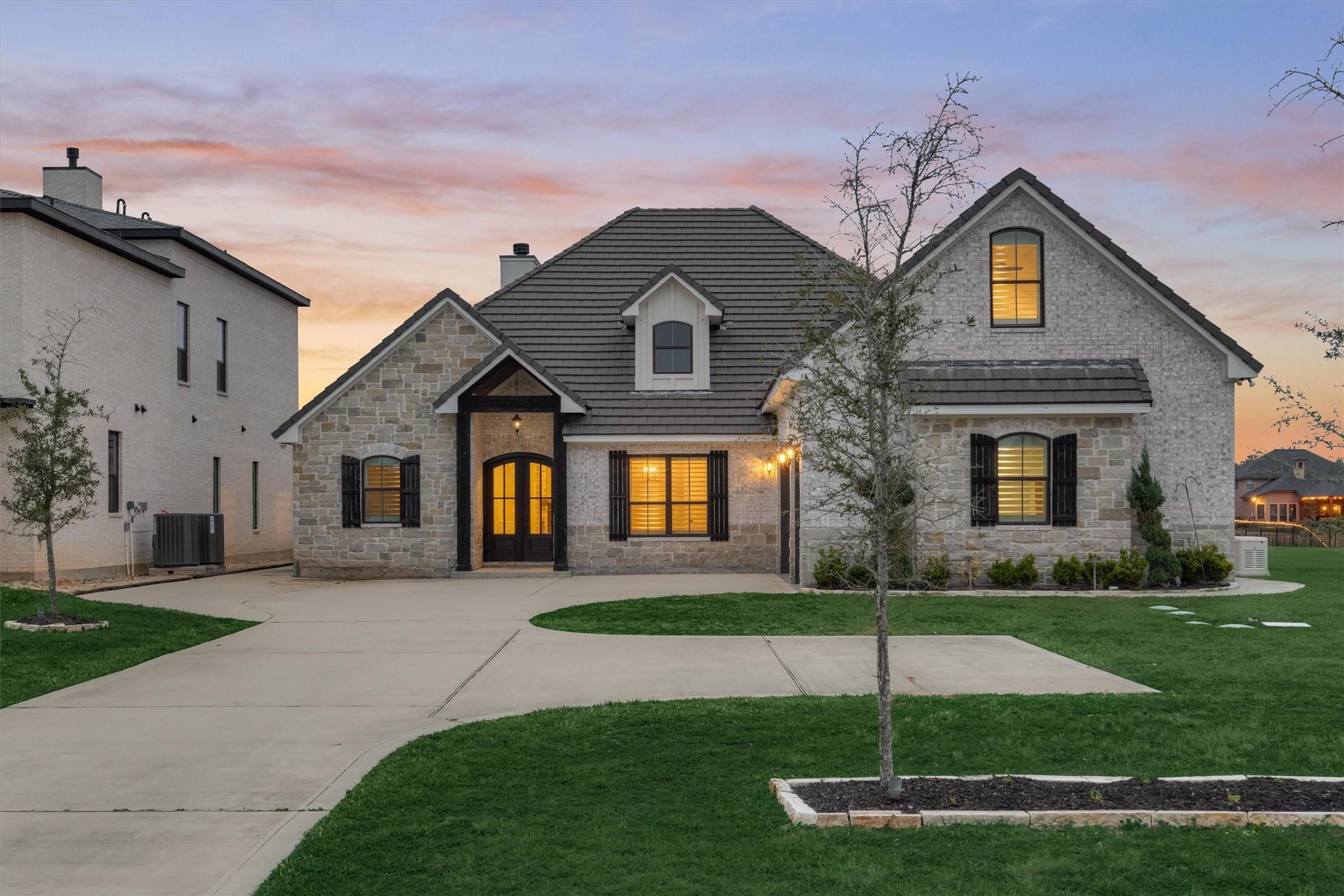 Image 2: The stunning front elevation showcases a beautiful