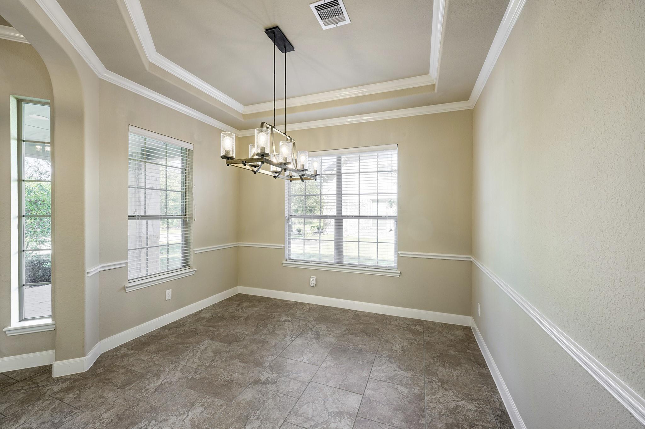 Image 4: Additional view of the formal dining room.