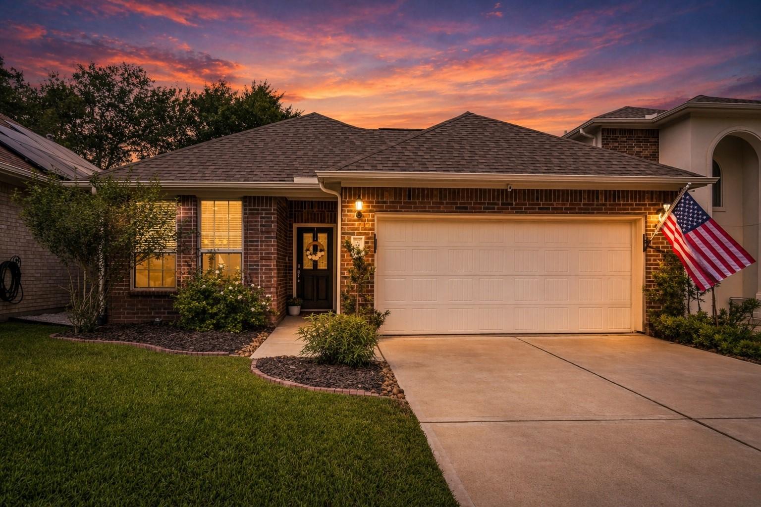 Image 2: Charming brick home with a well-maintained front y