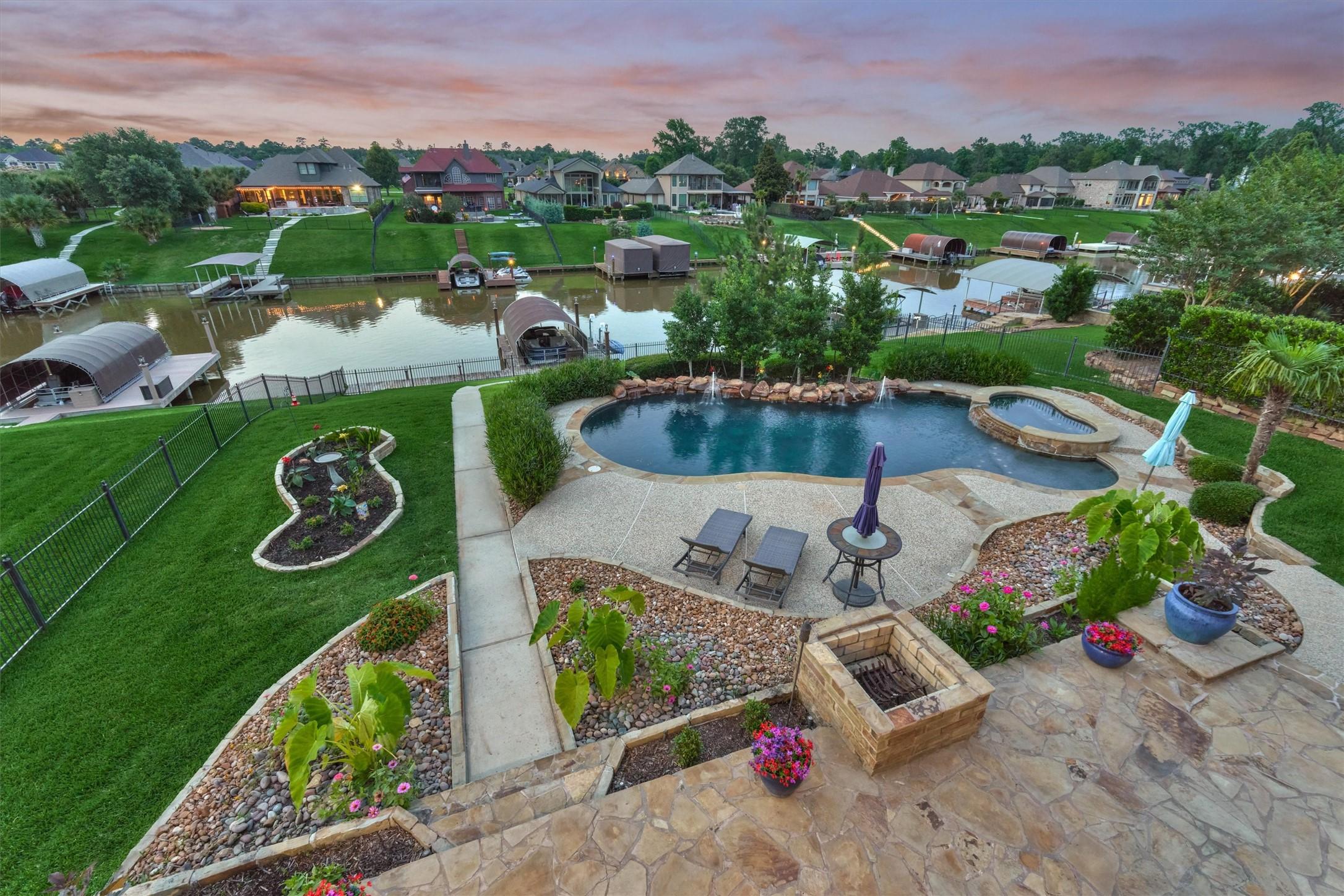 Image 2: This gorgeous backyard offers lush landscaping, a