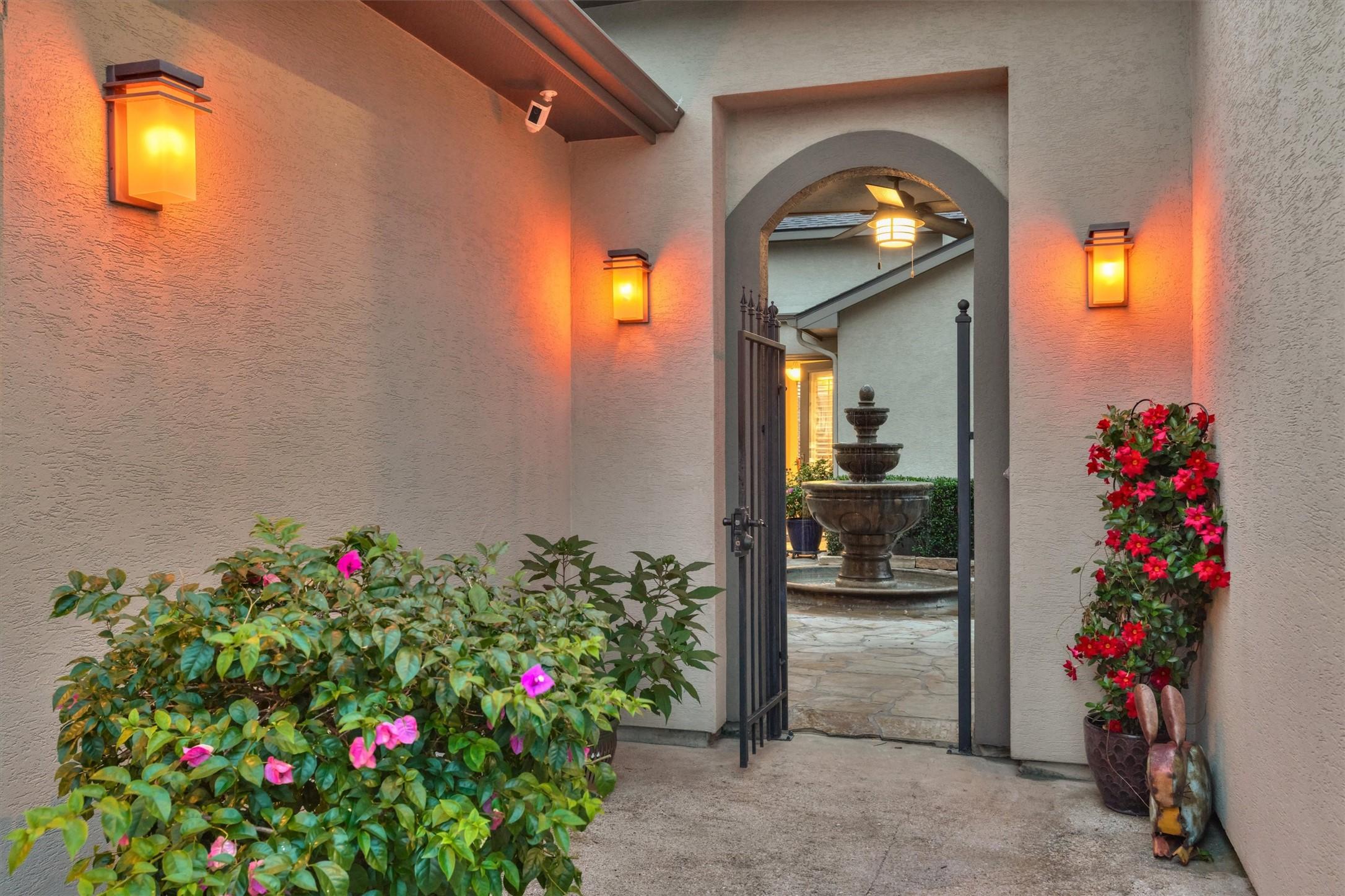 Image 3: Enter the front through a gated courtyard, featuri