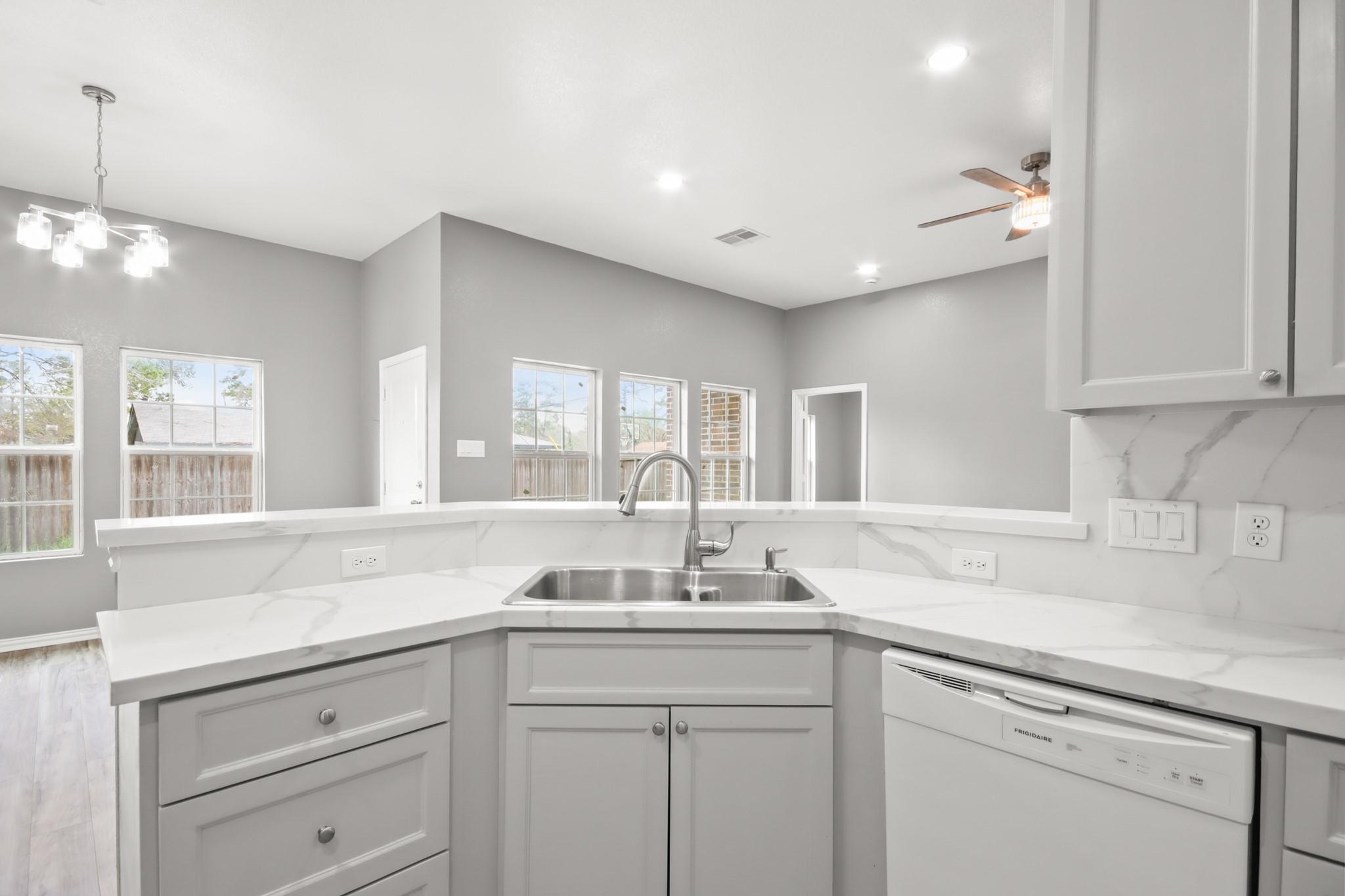 Image 1: Welcome to your BRAND NEW HOME! This modern kitche