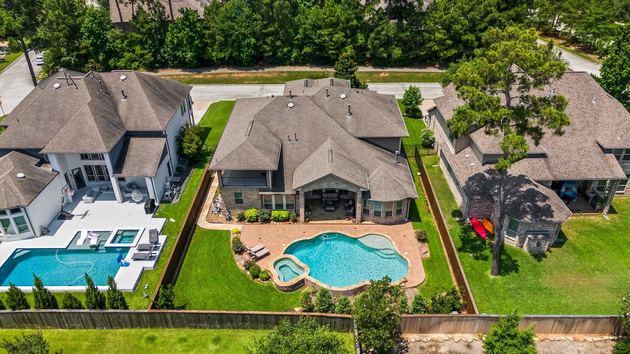 Image 2: This home offers a beautiful pool with multiple ou