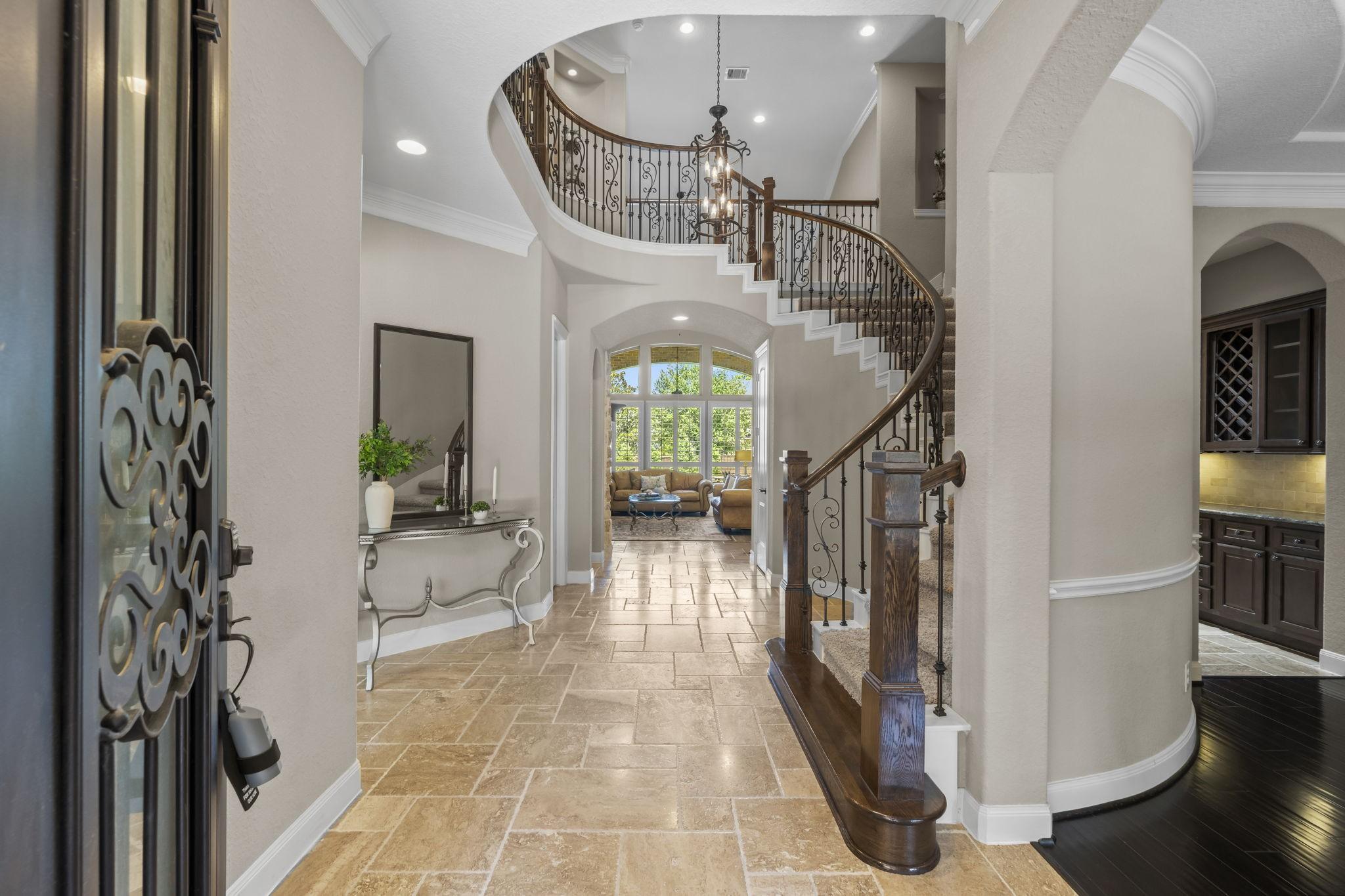 Image 3: Two story Entrance with Sweeping Staircase