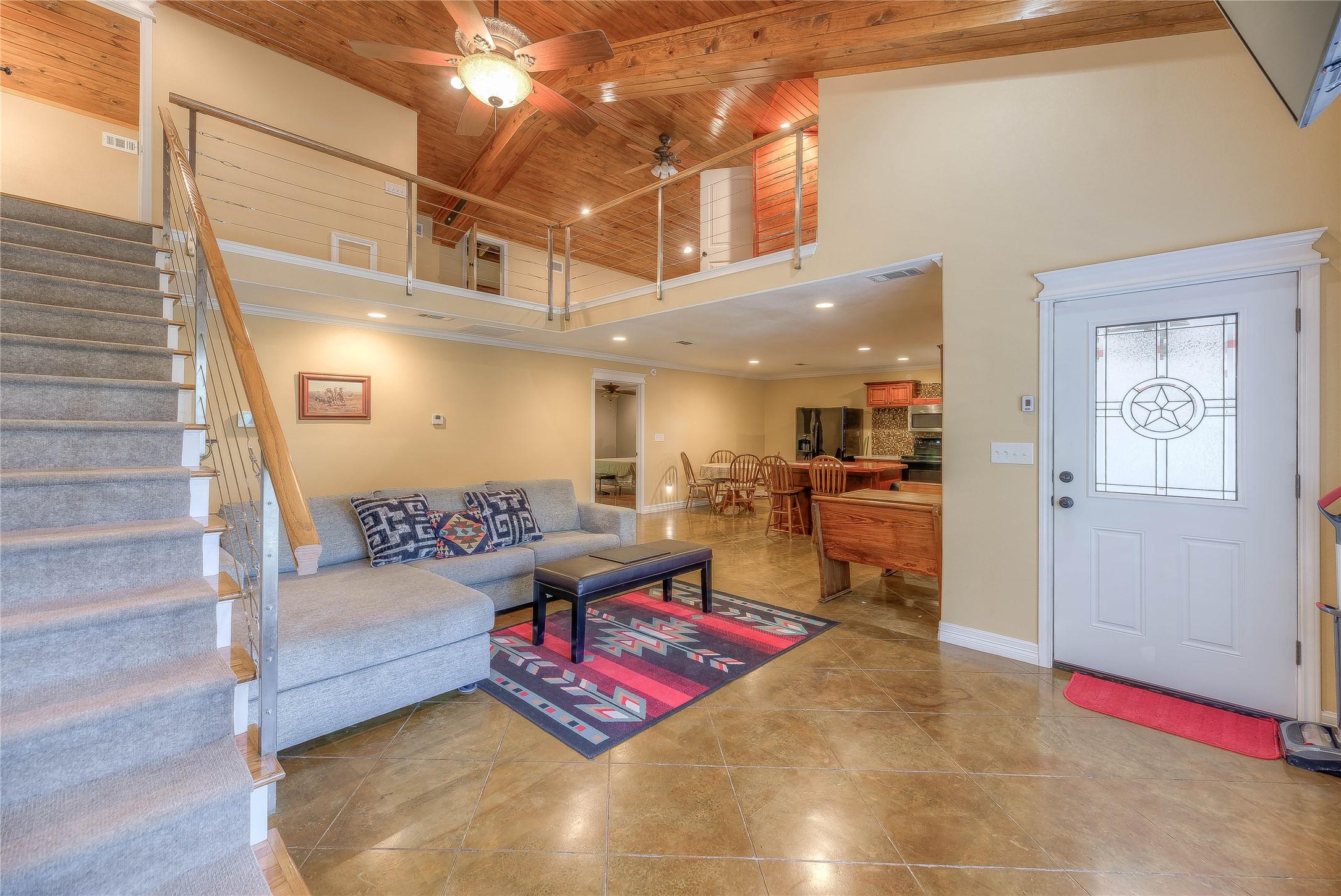 Image 2: Elegant tile flooring throughout the main living a