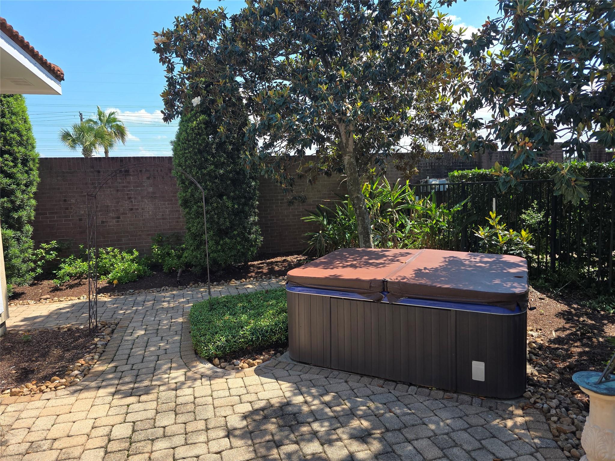 Image 3: Hot Tub in the Patio Area