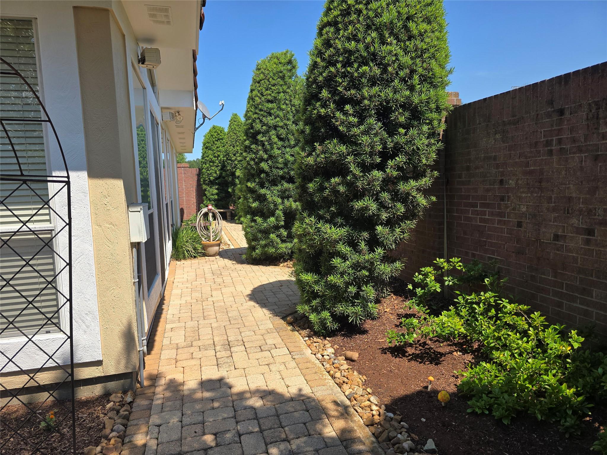 Image 4: The Patio Area continues around behind the House