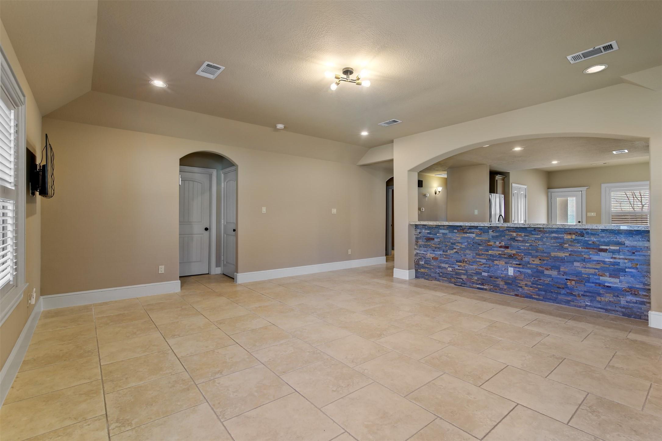 Image 3: View from the family room showcasing the open conc