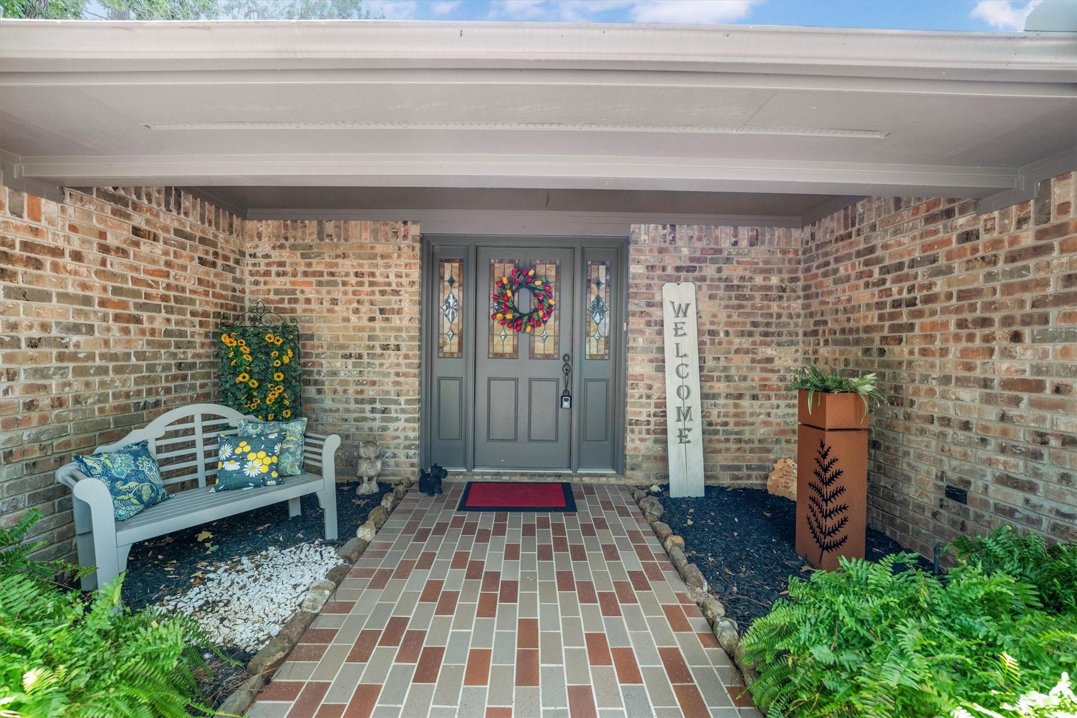 Image 3: Inviting covered front entry features a charming b