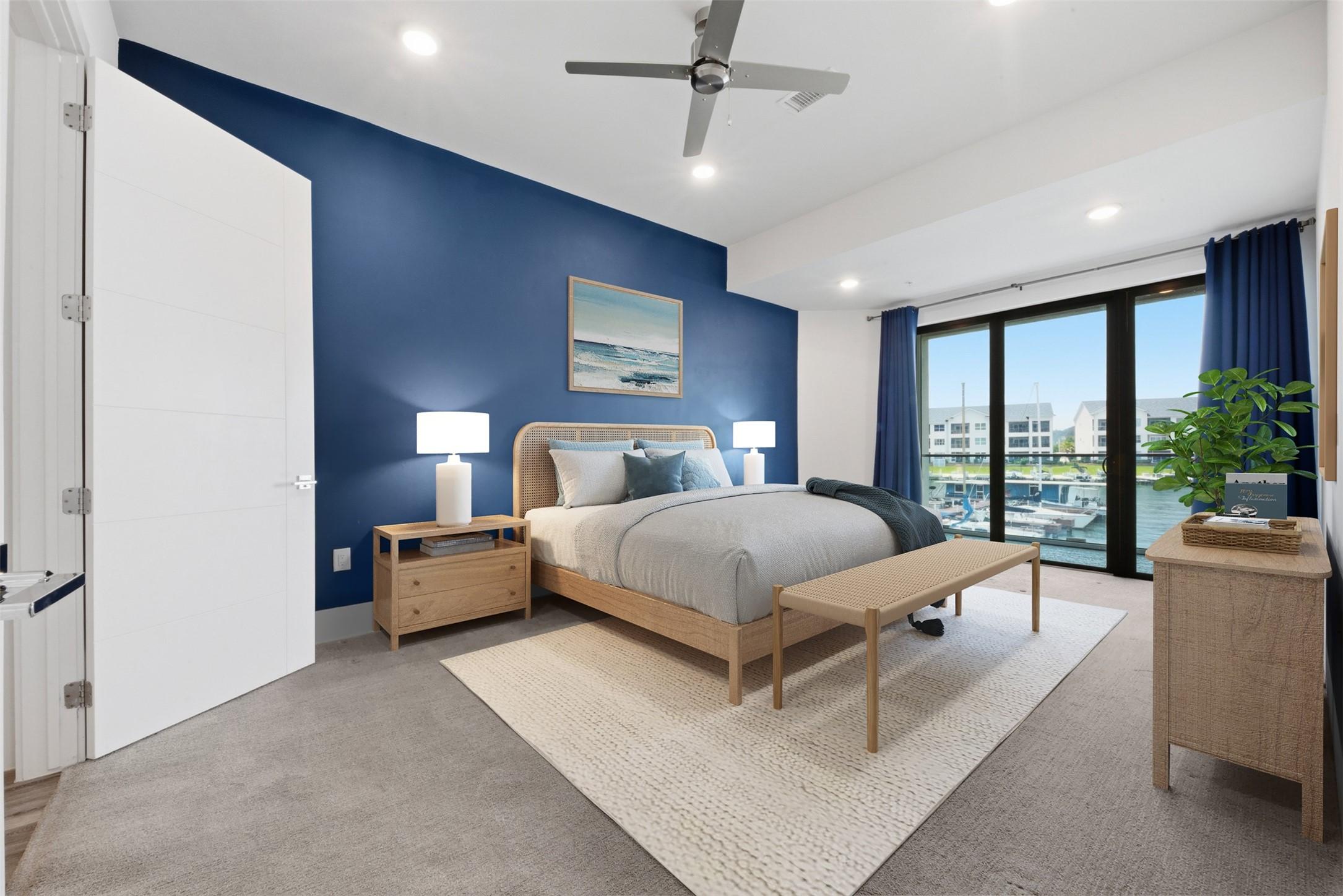 Image 1: Primary bedroom - Waterfront views!