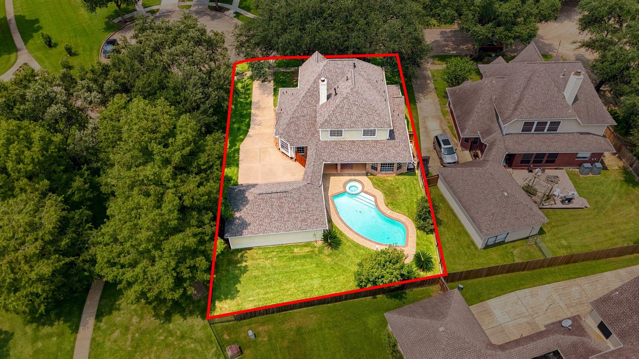 Image 3: This aerial view showcases a spacious two-story ho