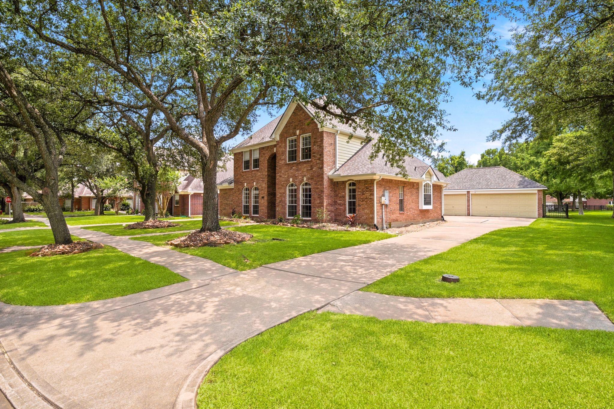 Image 4: Charming two-story brick home with a large front y