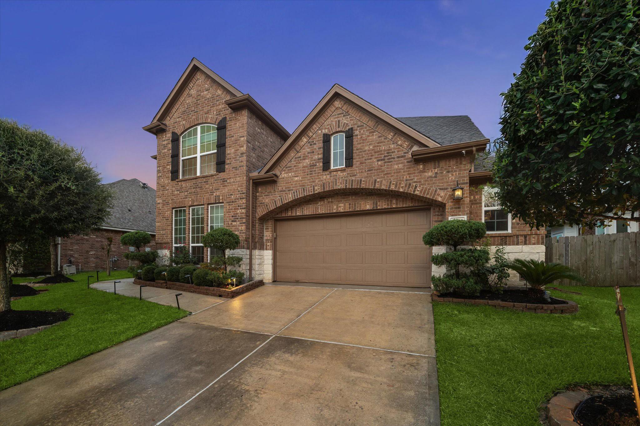 Image 2: Your private driveway leads to a 2-car garage with