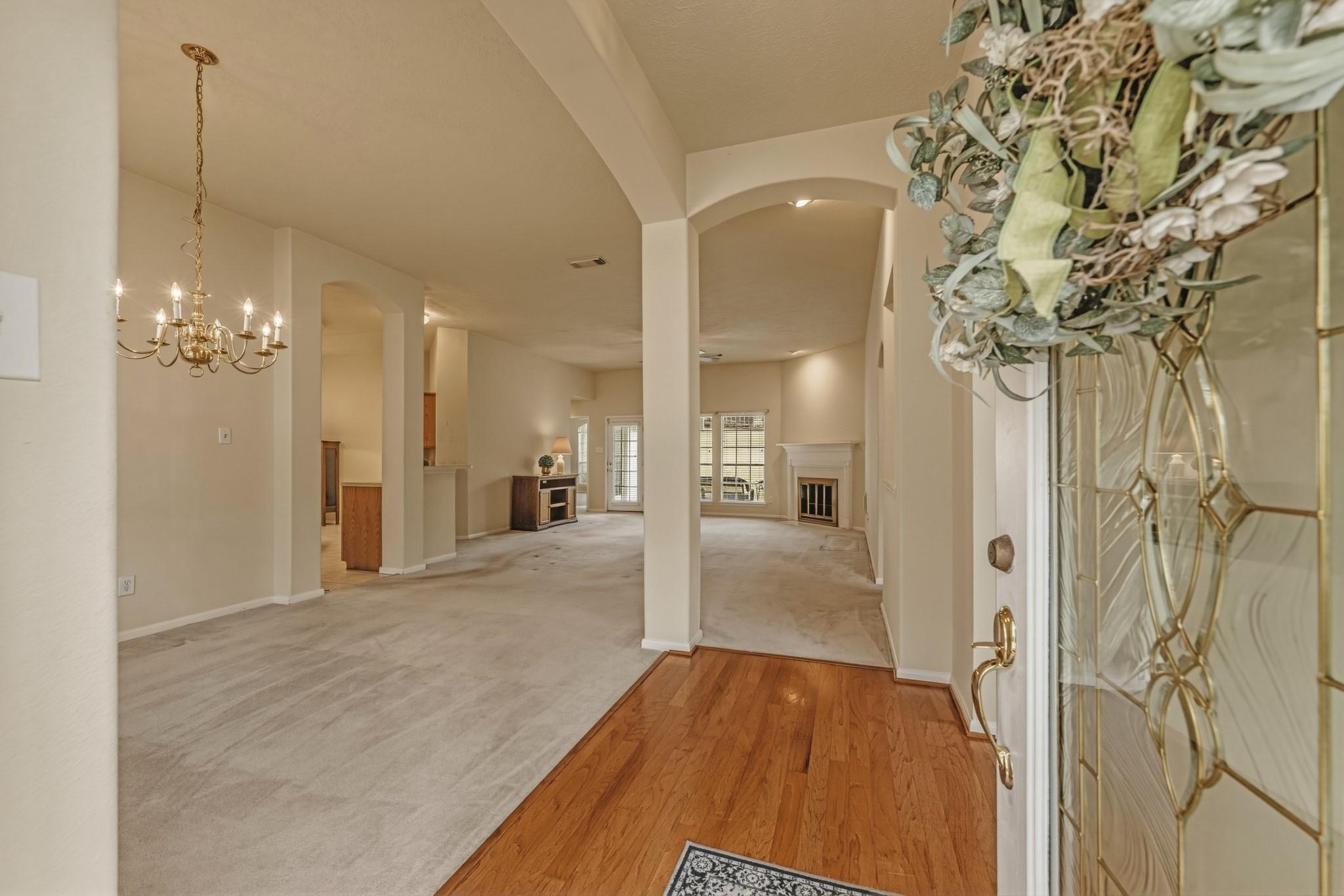 Image 4: Spacious Living Room with Fireplace open to kitche