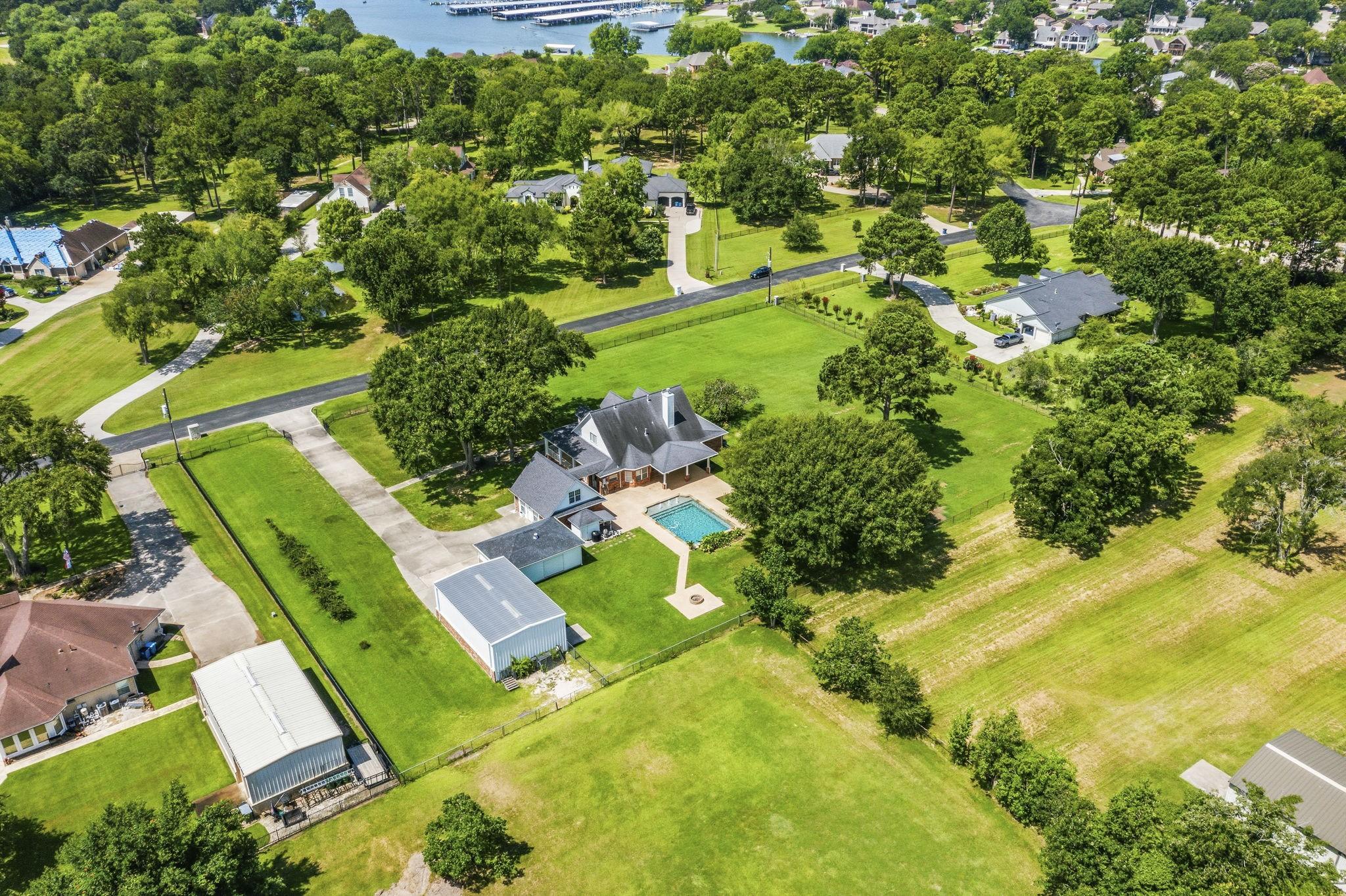 Image 1: Aerial view of the property on 1.75 acres.