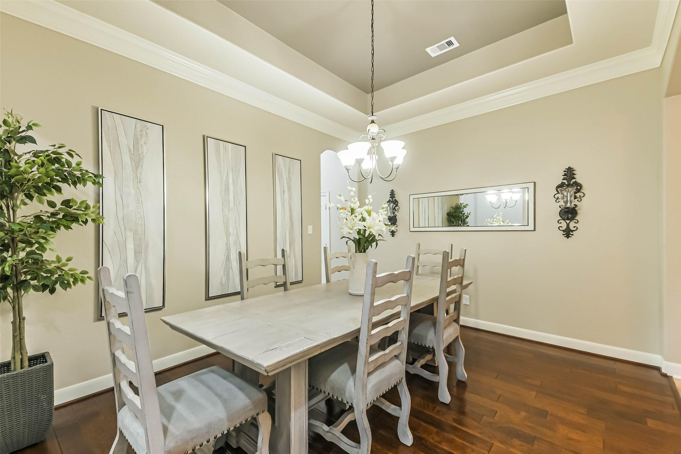 Image 4: Elegant formal dining room, perfect for hosting ho