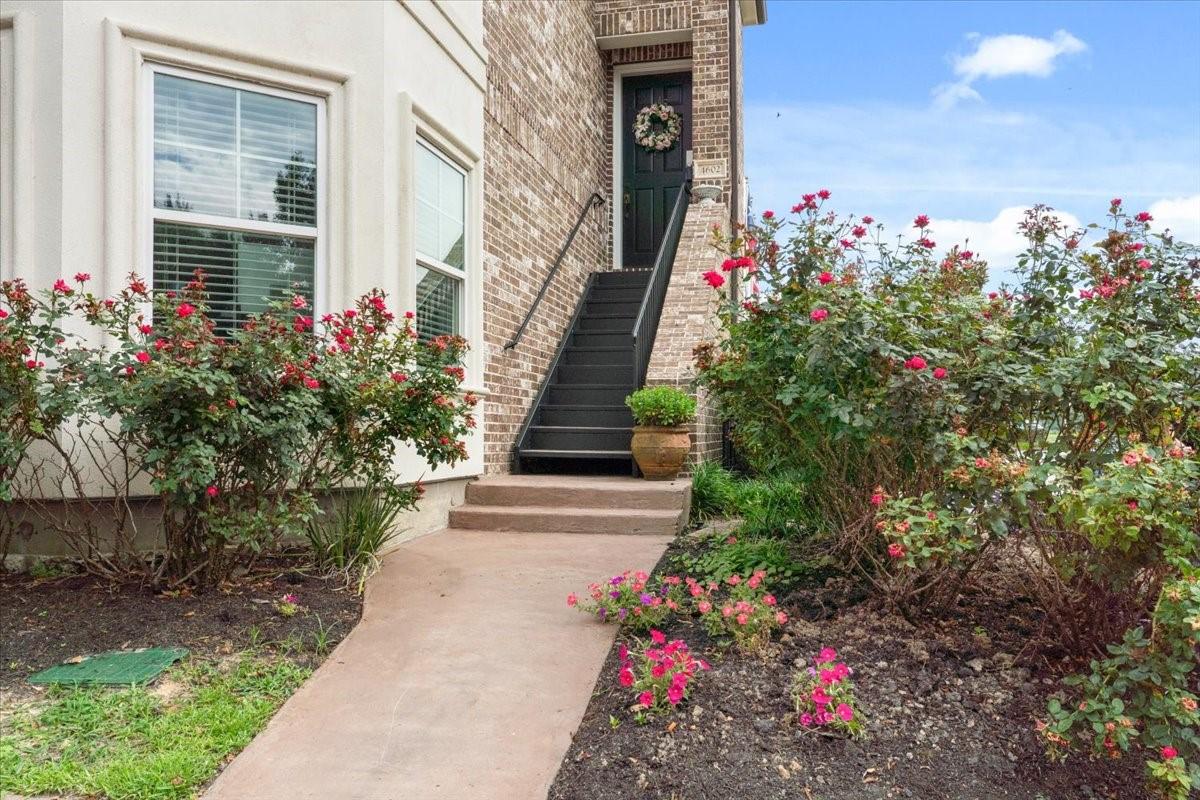 Image 1: This charming front entrance welcomes you with a b