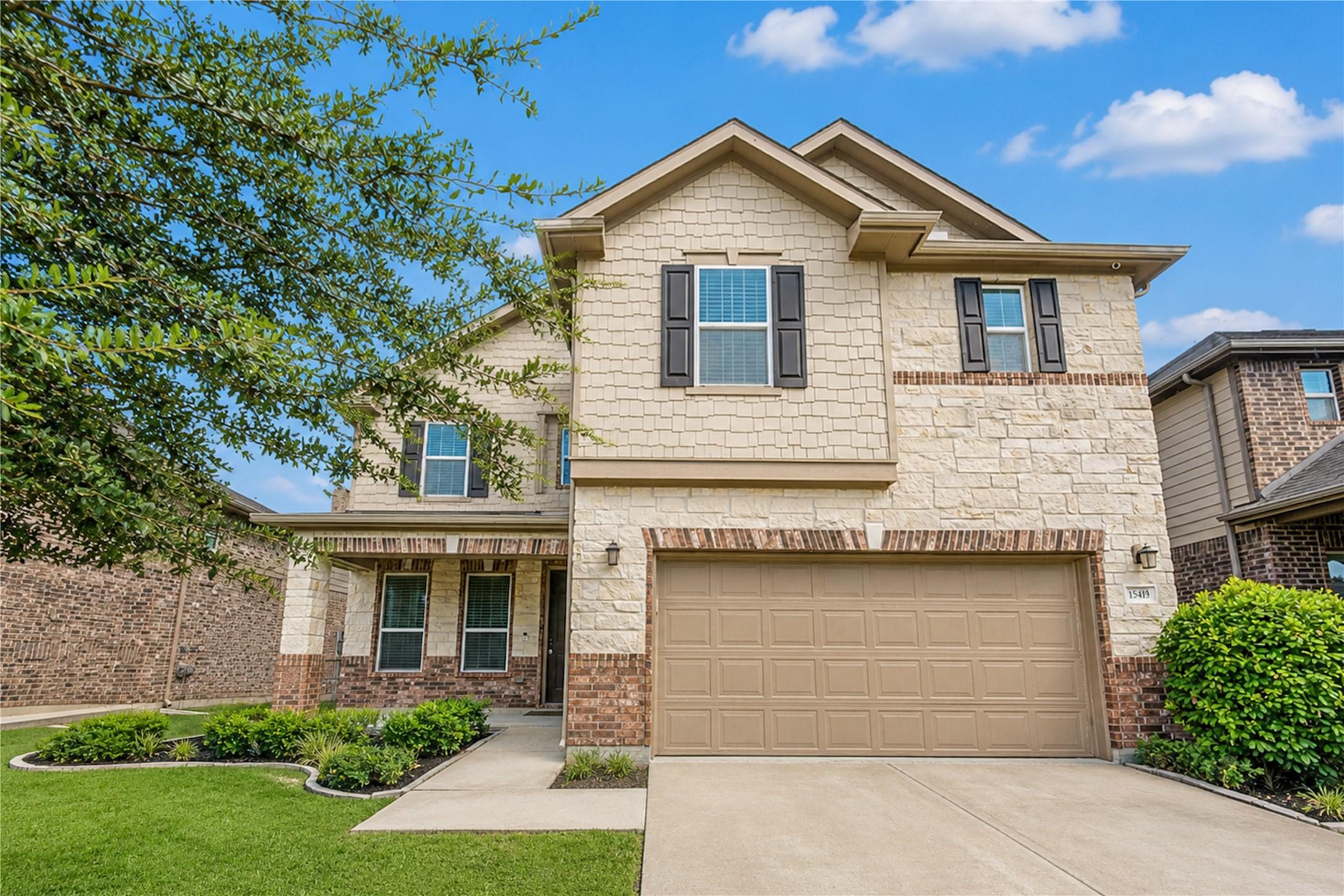 Image 1: Beautiful curb appeal welcomes you home with an at