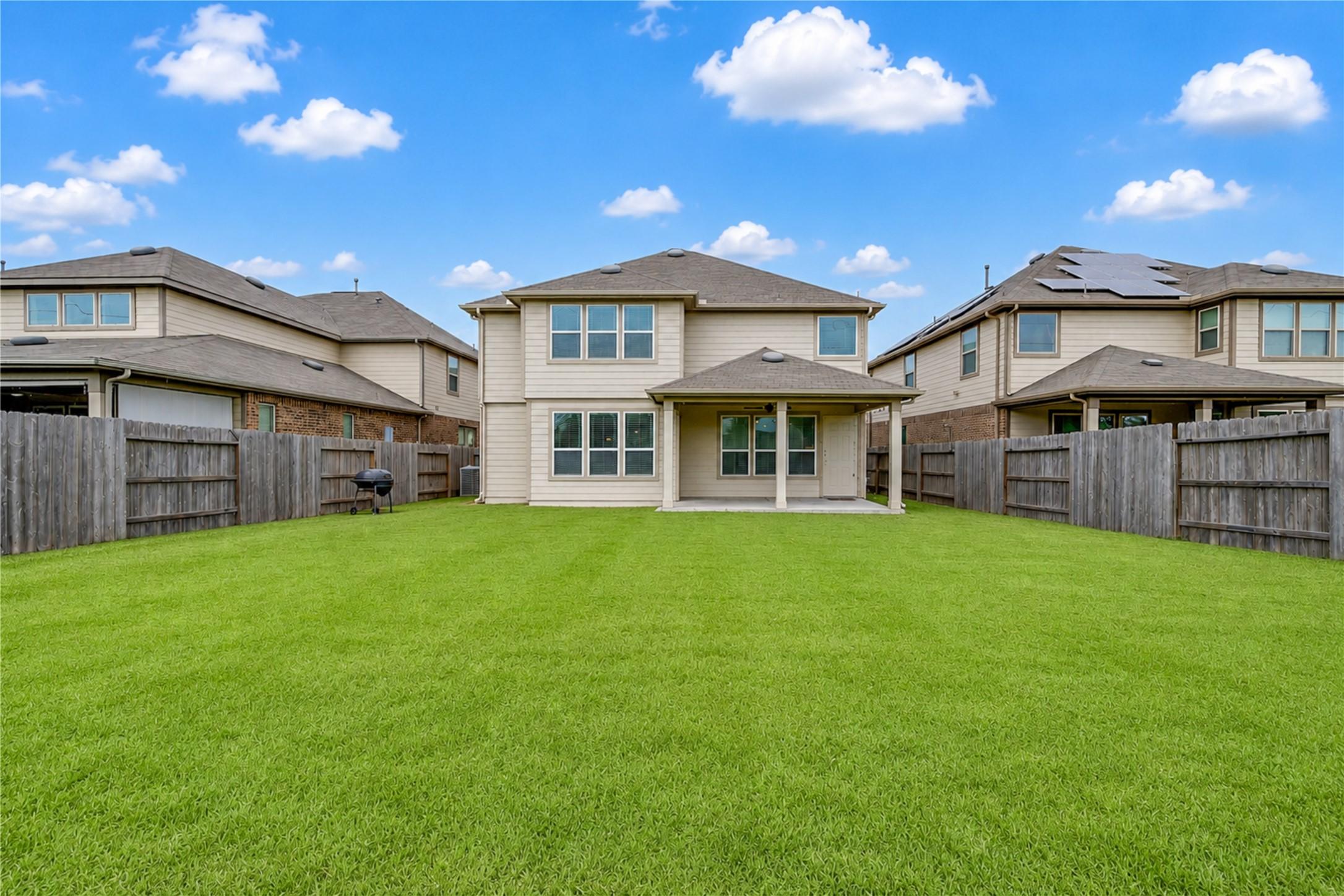 Image 3: Enjoy a spacious, fully fenced backyard with plent