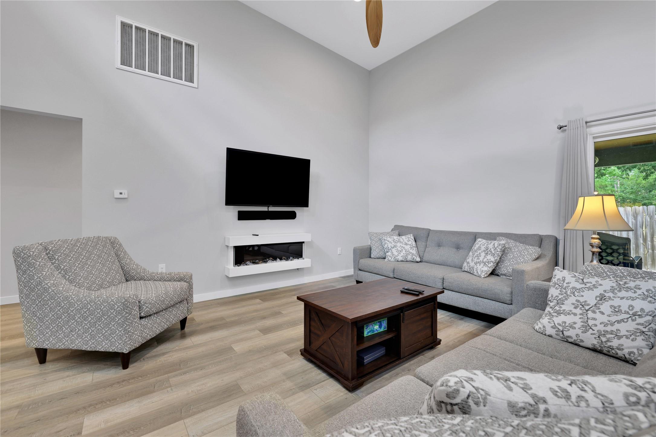 Image 3: Experience the inviting living room area, complete