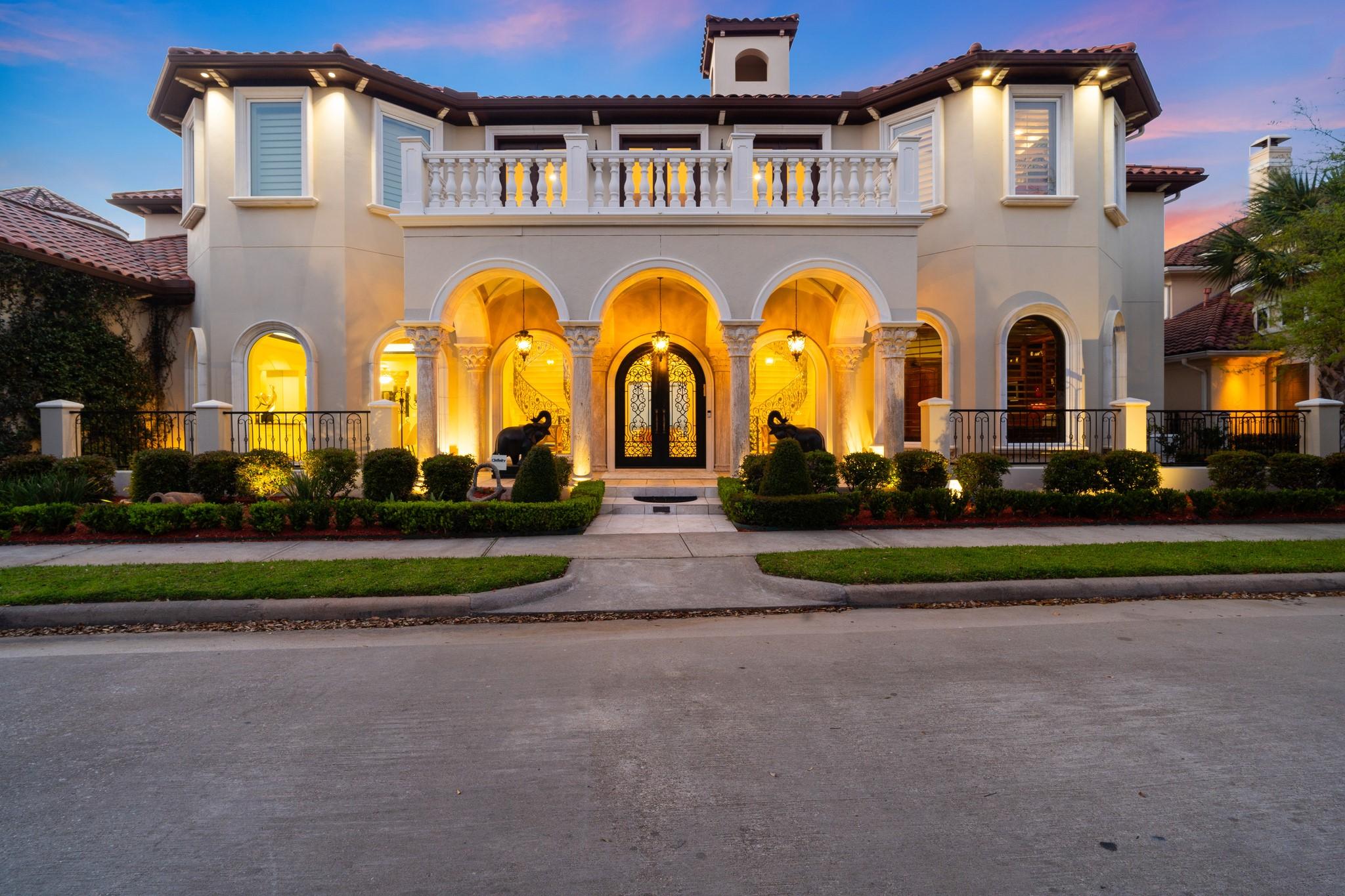 Image 2: This Mediterranean style home sits on nearly hal