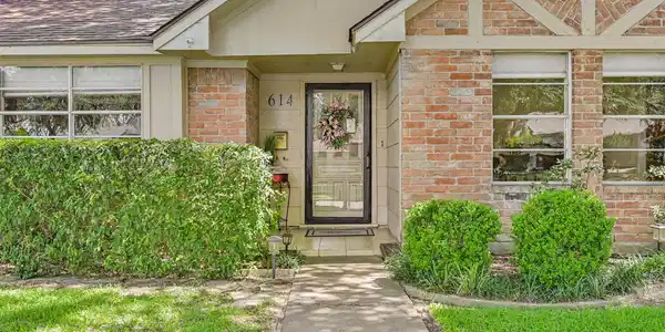 Image 3: What a charming entry that is covered! Home has ju