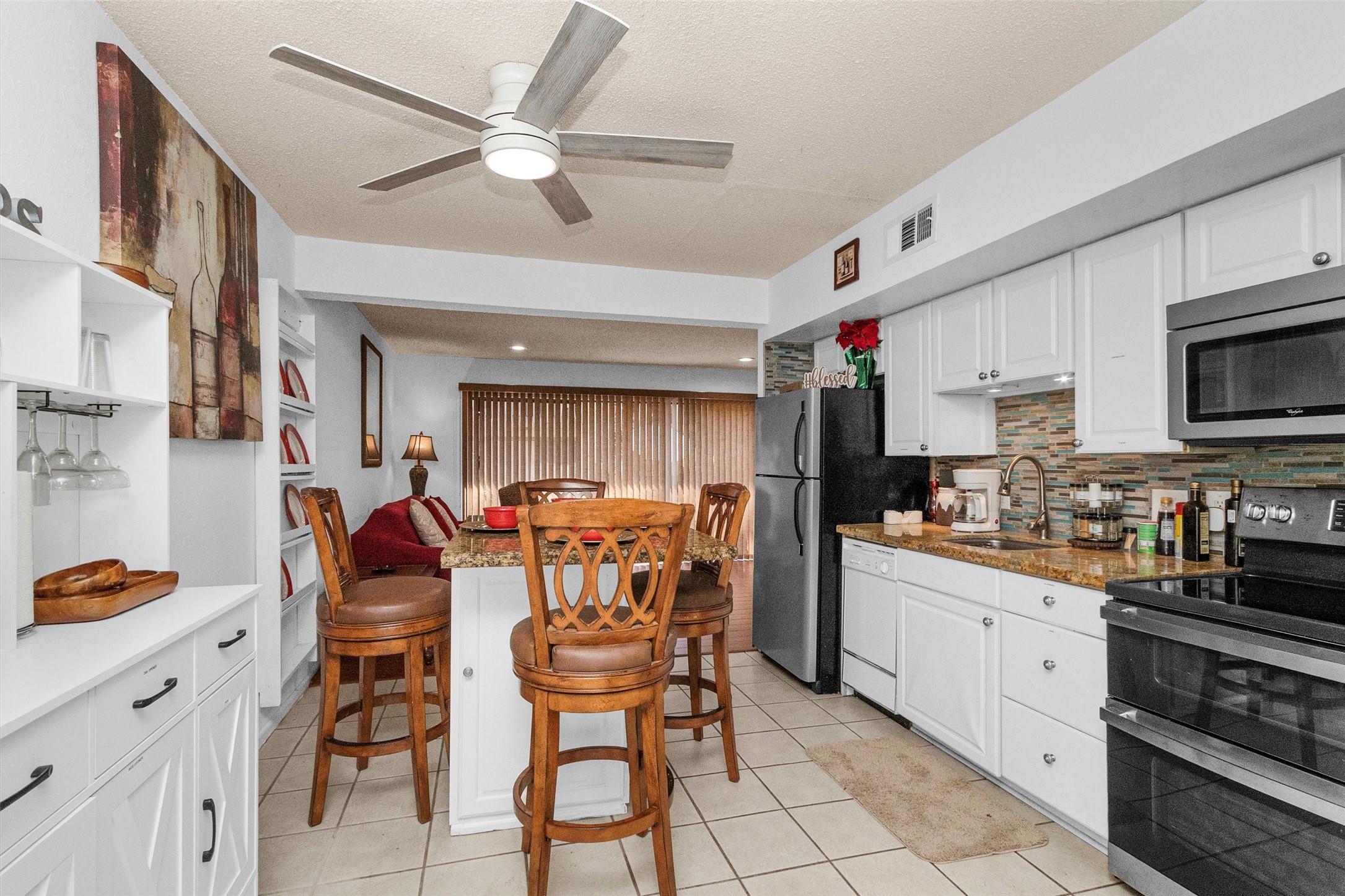 Image 3: Discover a bright and inviting kitchen with modern