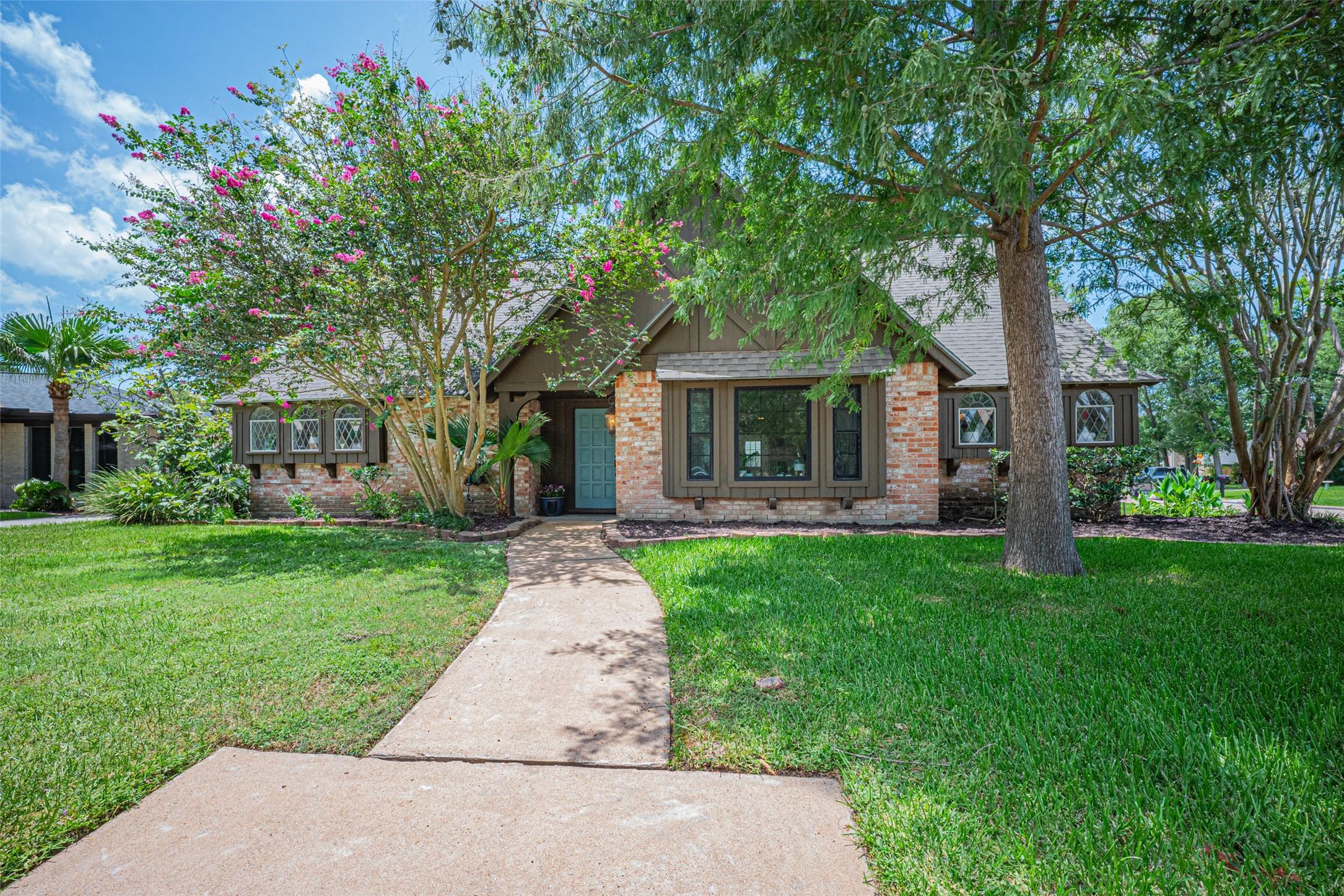 Image 2: Nestled on a corner cul-de-sac lot, this home has