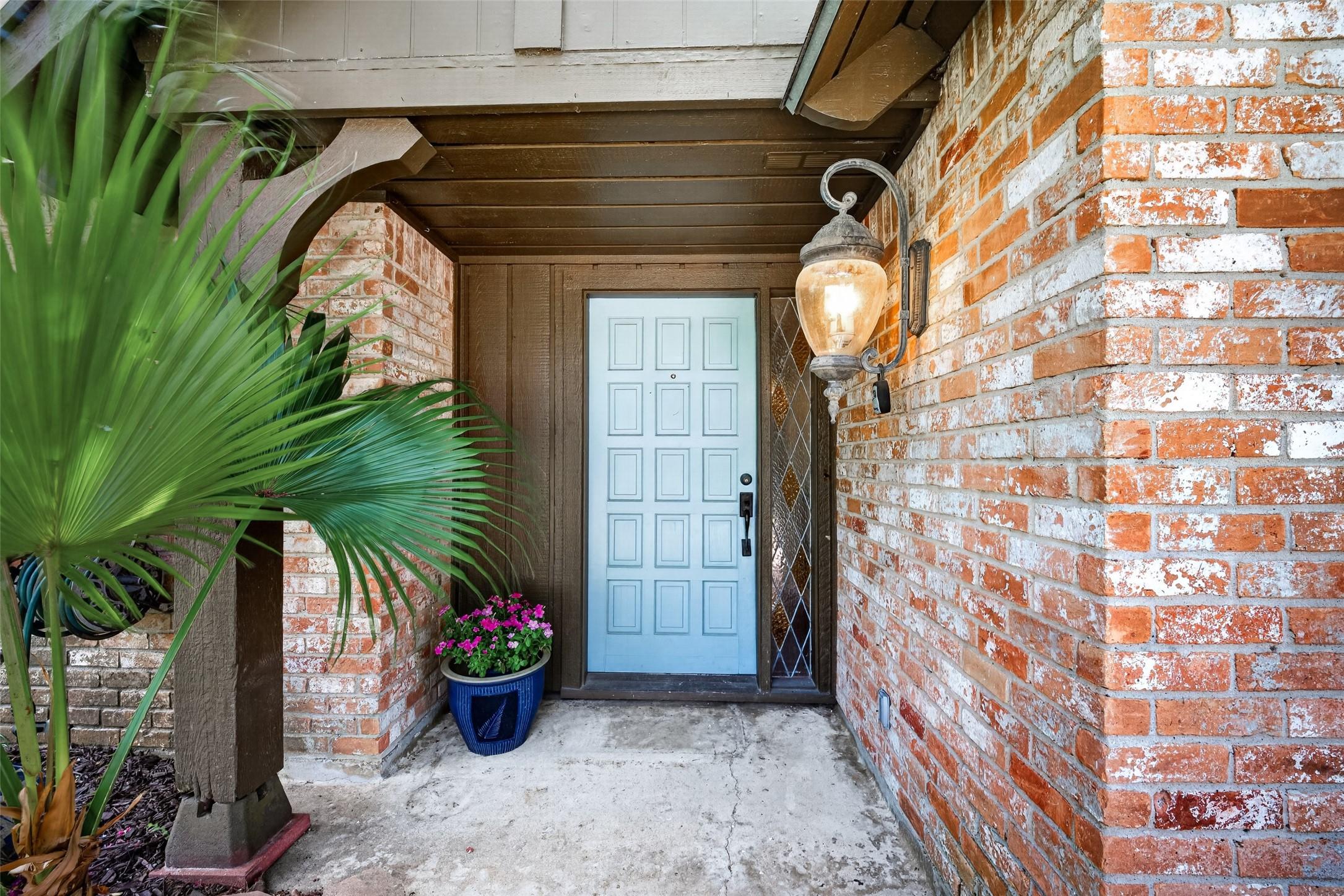 Image 3: Front entry with decorative diamond sidelight.