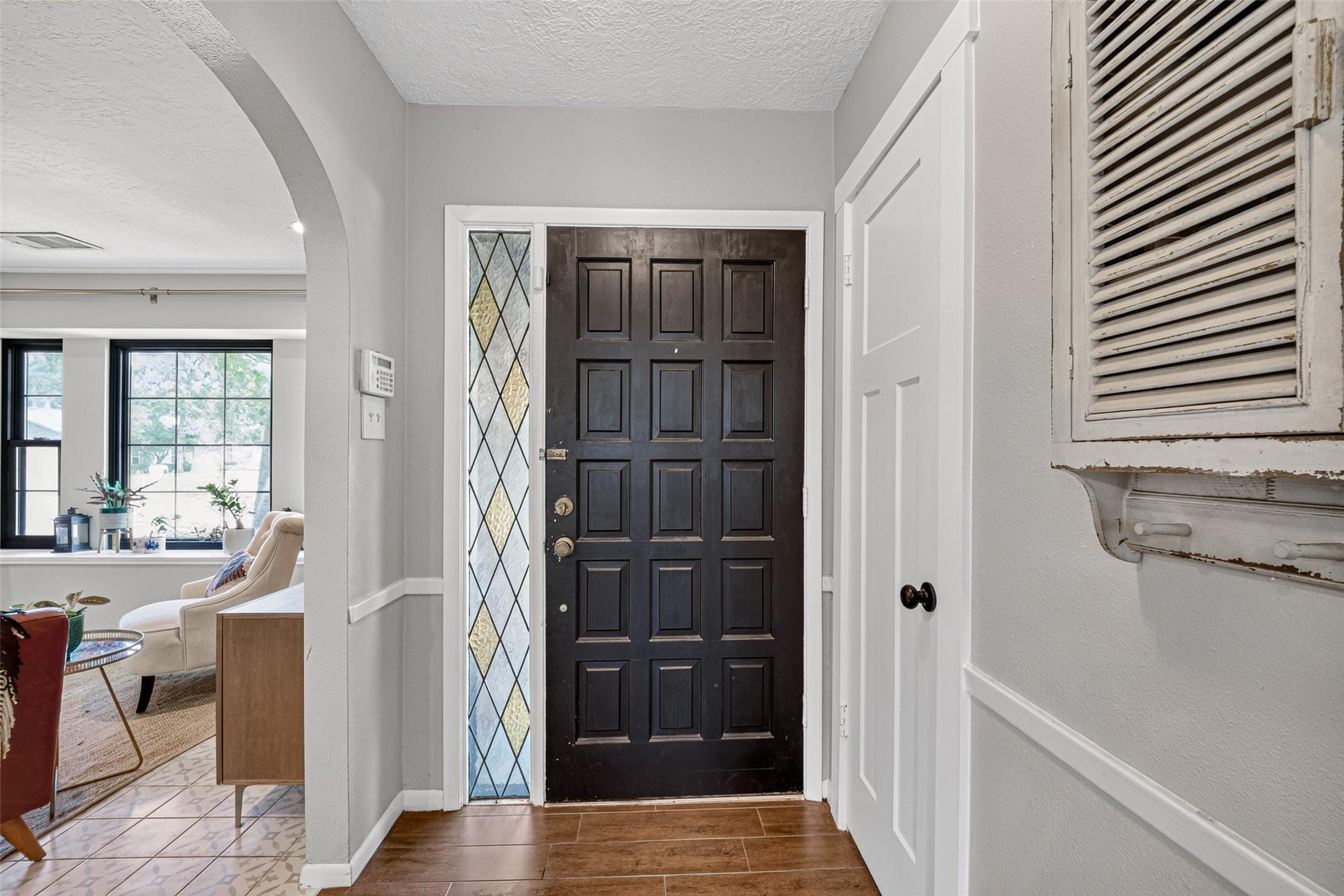 Image 4: Front entry with a view of the arched doorways.