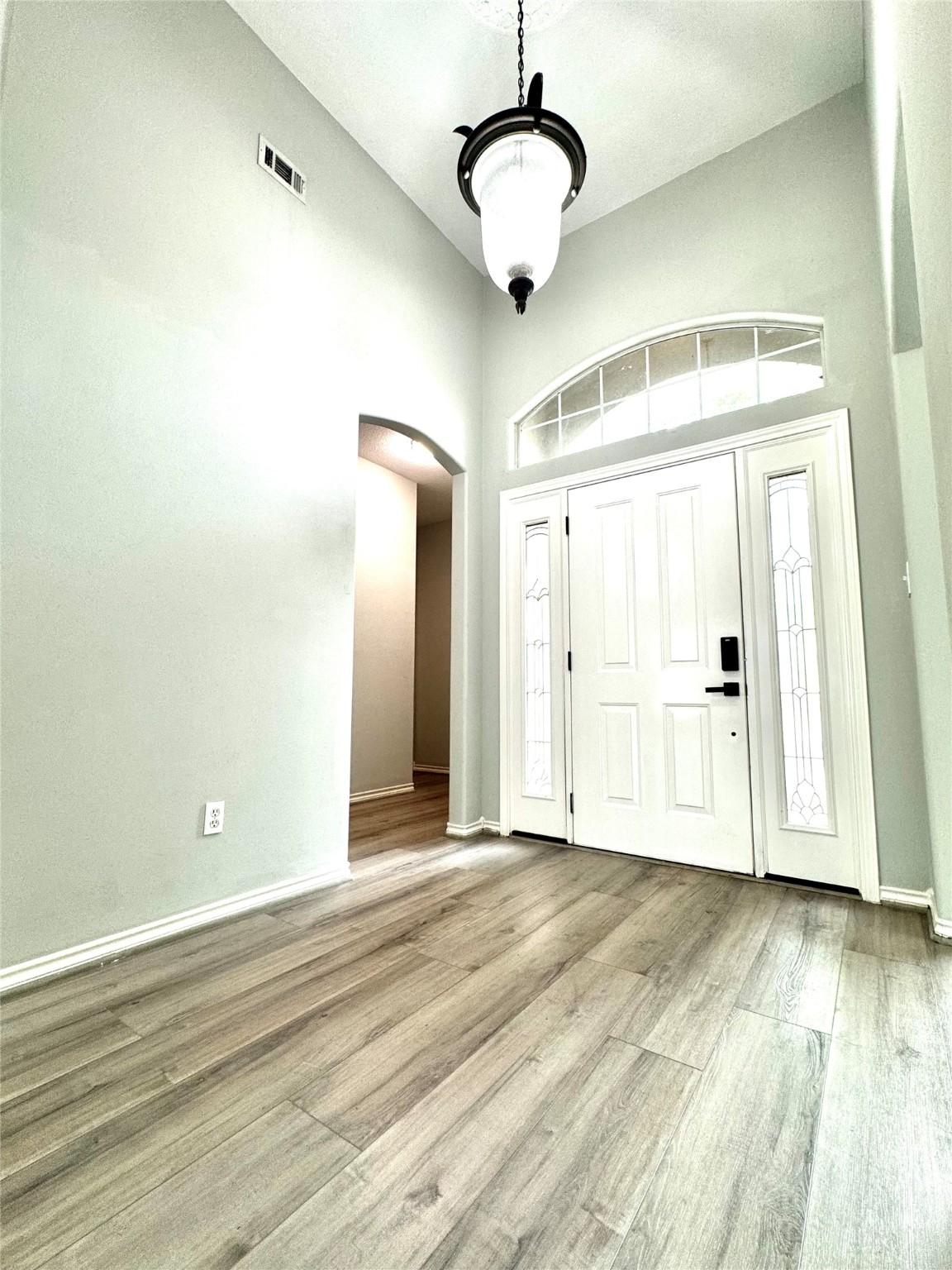 Image 4: Foyer entry with soaring 12' ceilings
